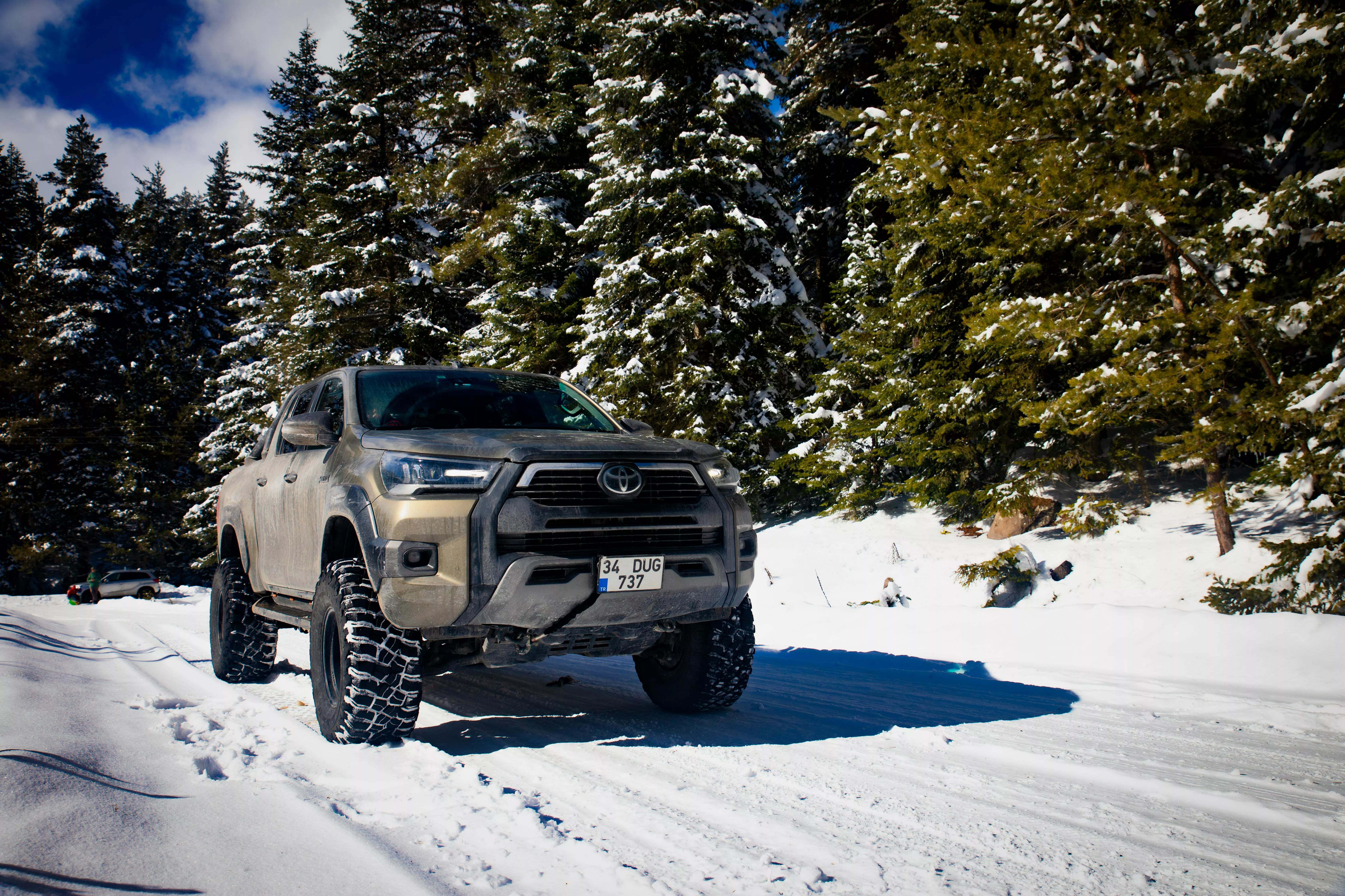 Toyota Hilux in Forest in Winter · Free