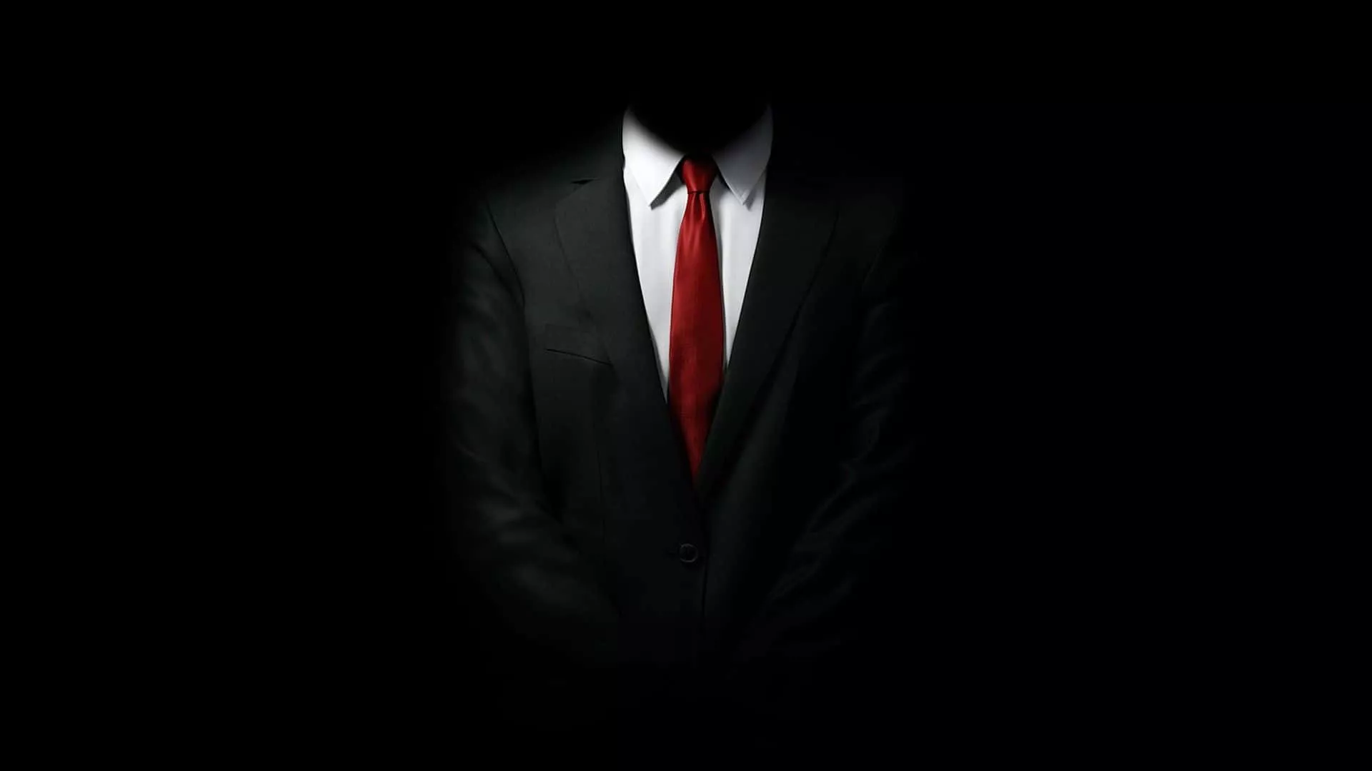 Red Tie on Dark Suit Wallpaper