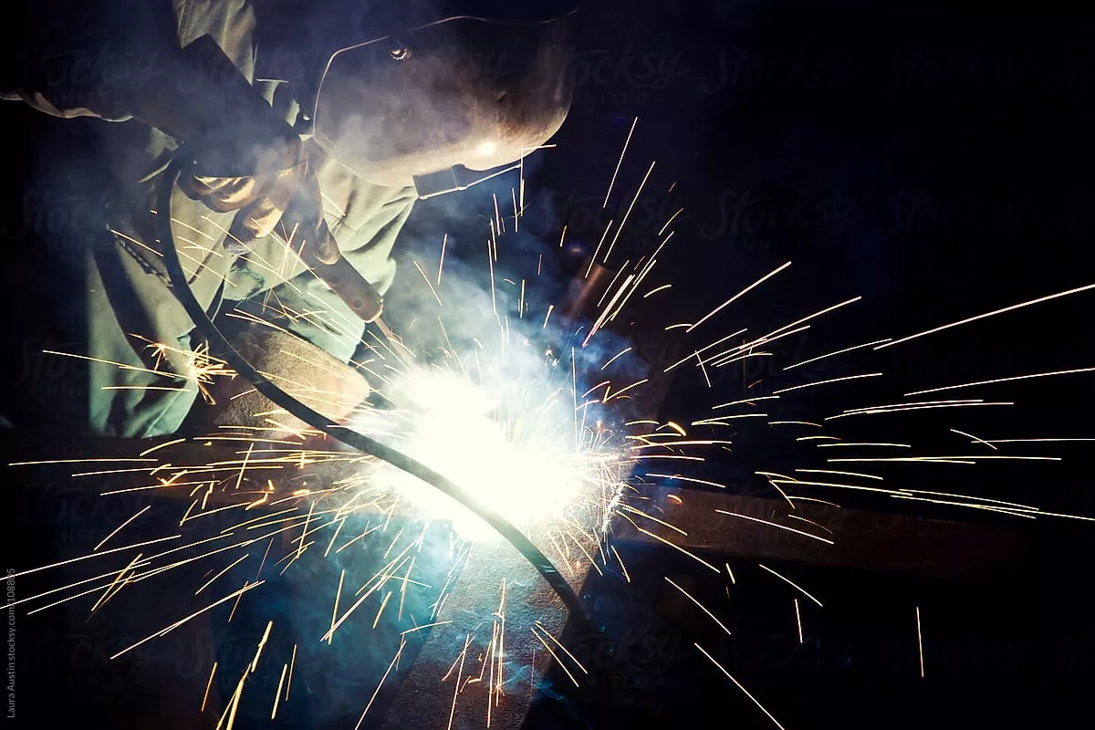 Metal Worker Soldering Metal With