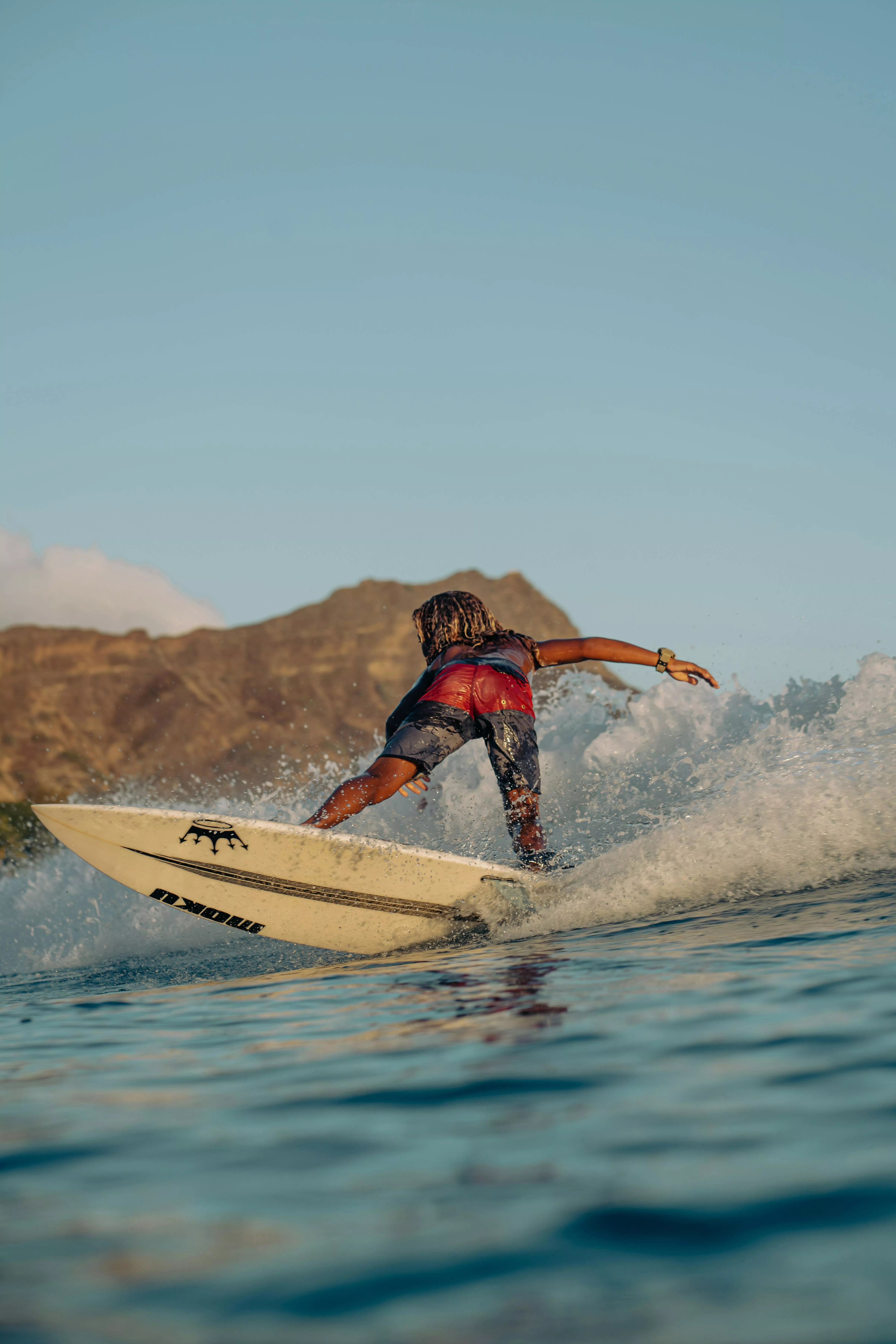A Surfer Riding Waves at Sea · Free