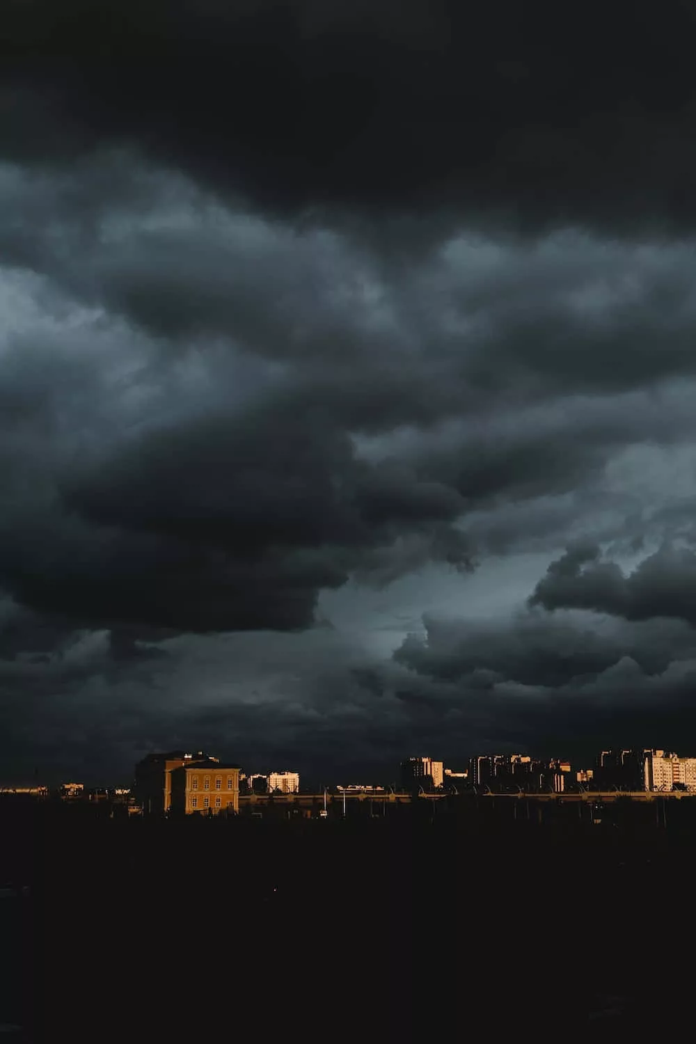 Download dark clouds over a city