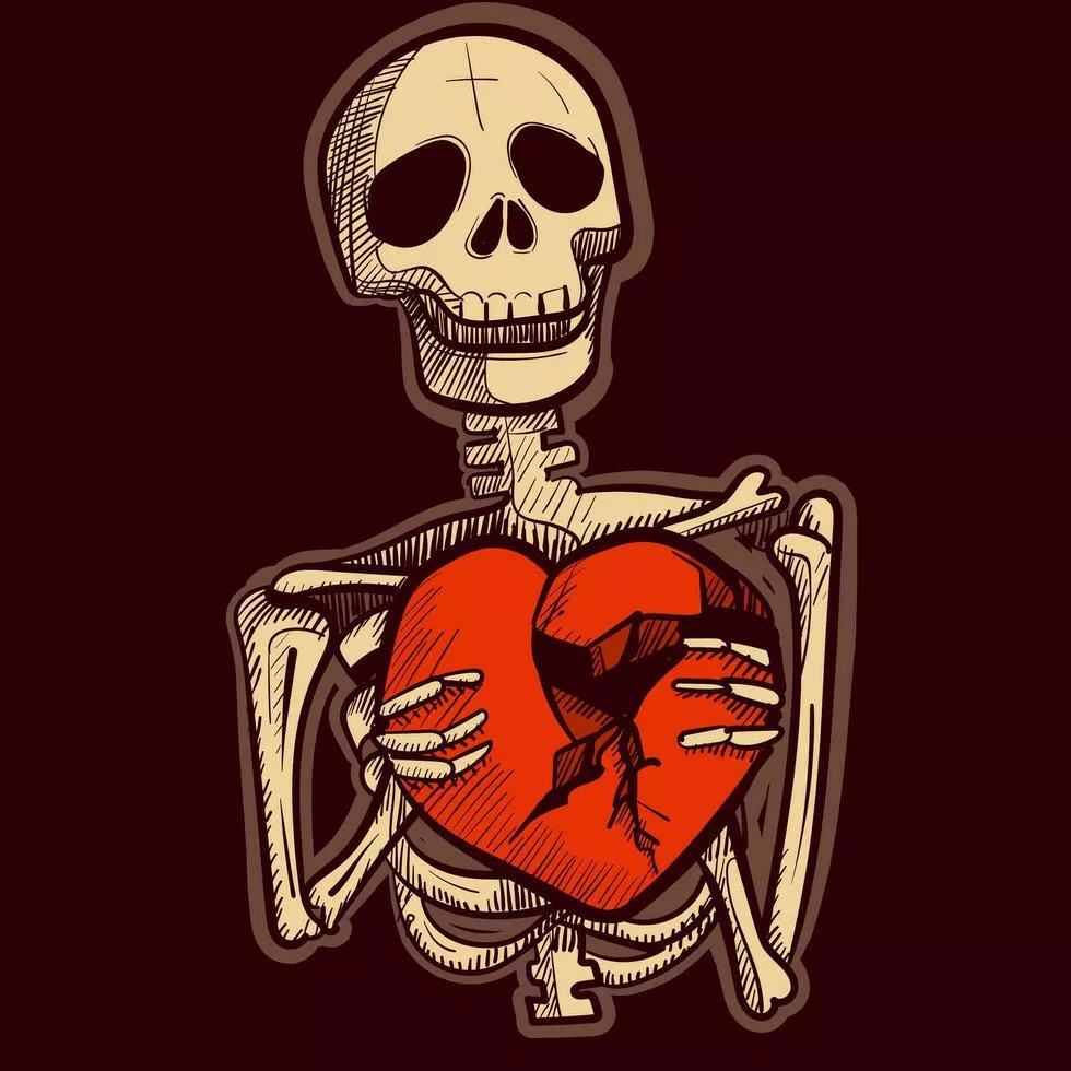 skeleton holding a broken heart