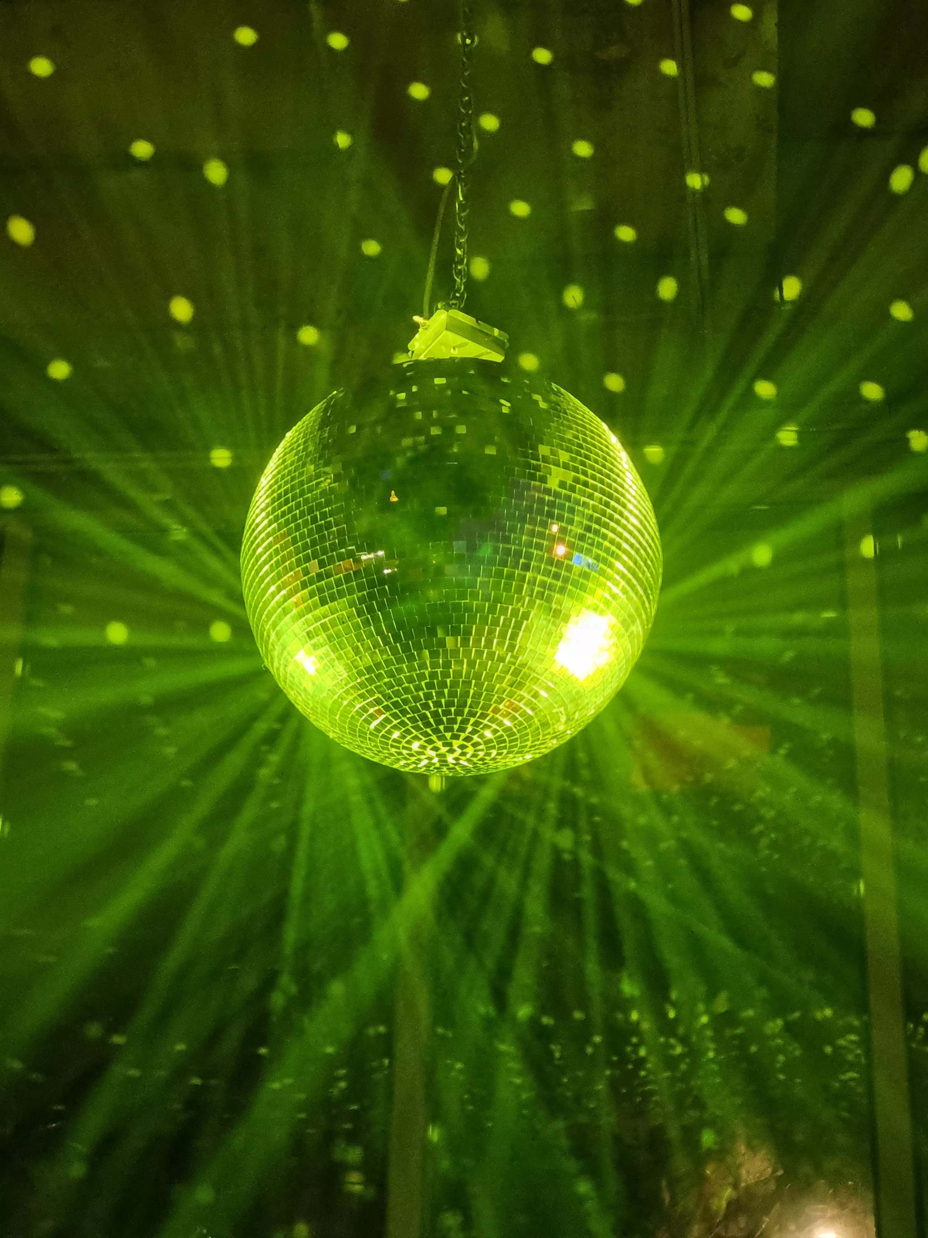Disco Ball Reflecting Green Light