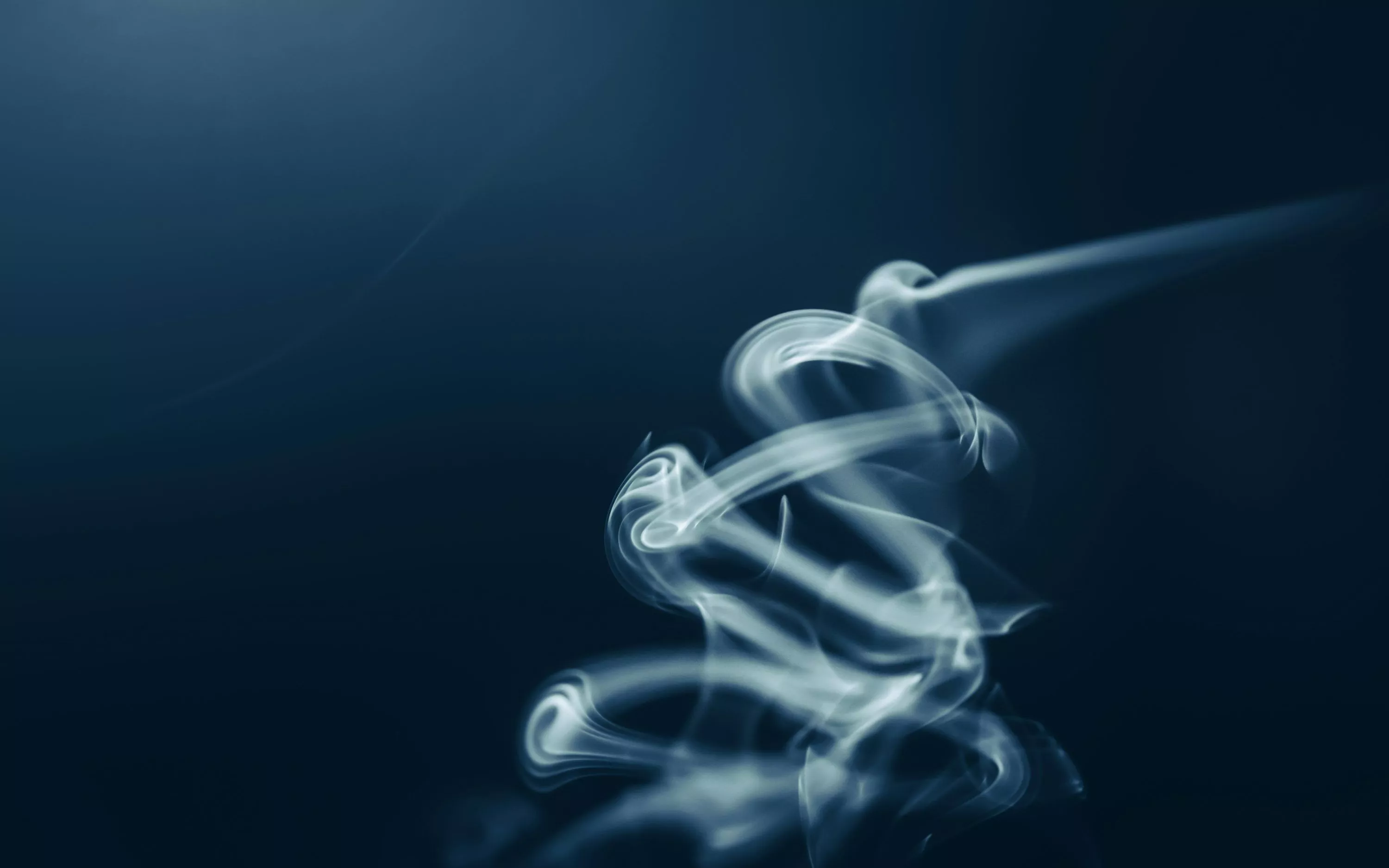 A blurry photo of a smoke stack on a