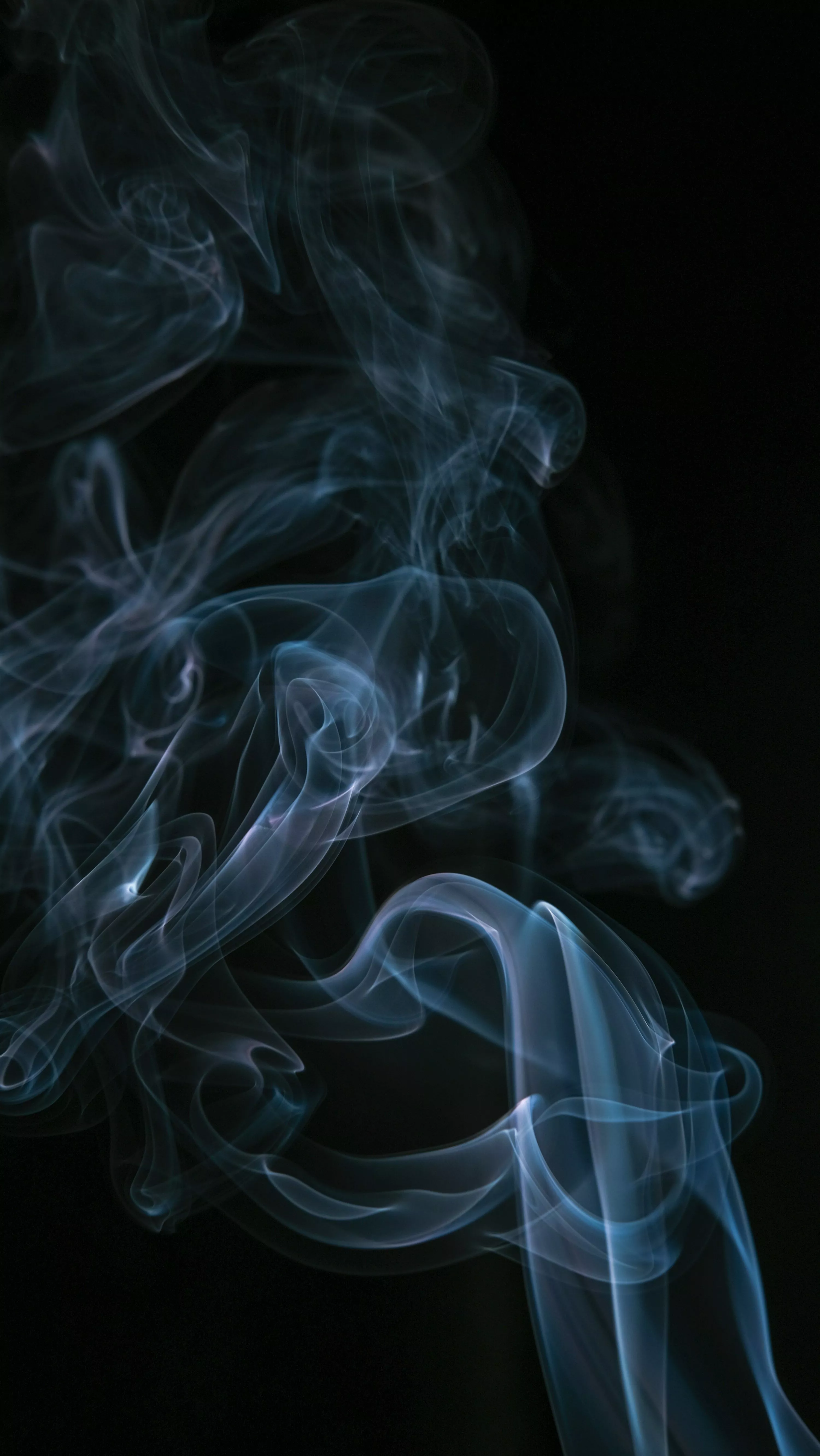 White smoke in black background photo