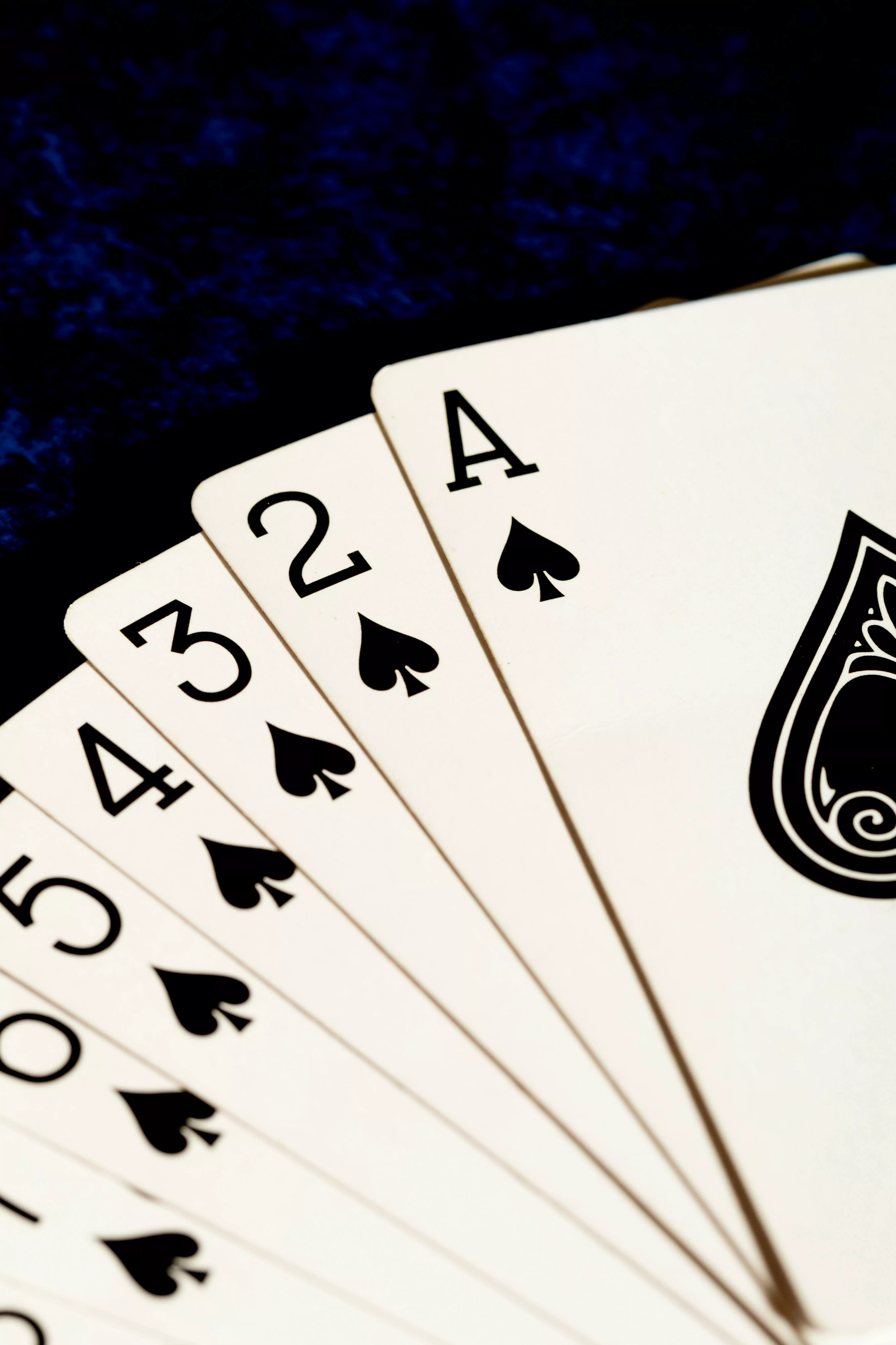 A close up of four playing cards
