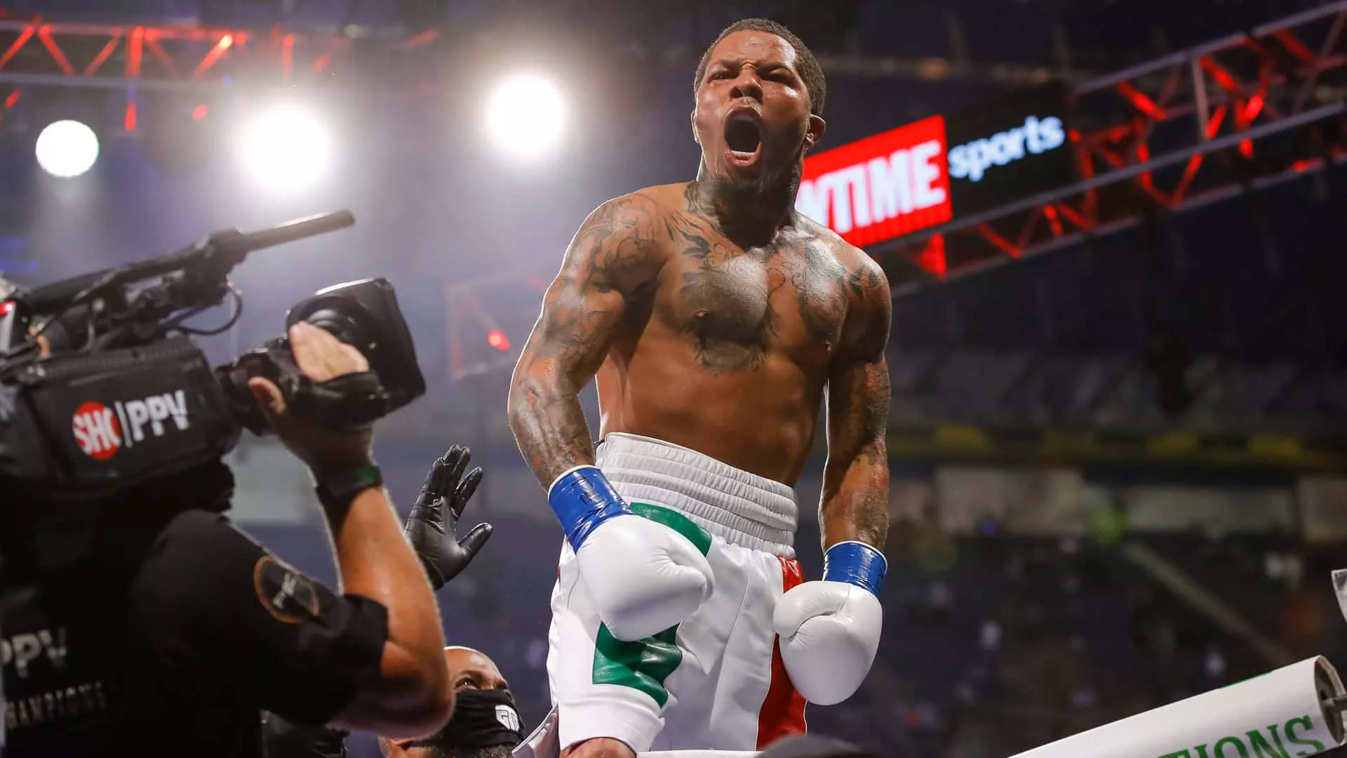 Download Gervonta Tank Davis delivers a powerful punch in the ring. Wallpaper