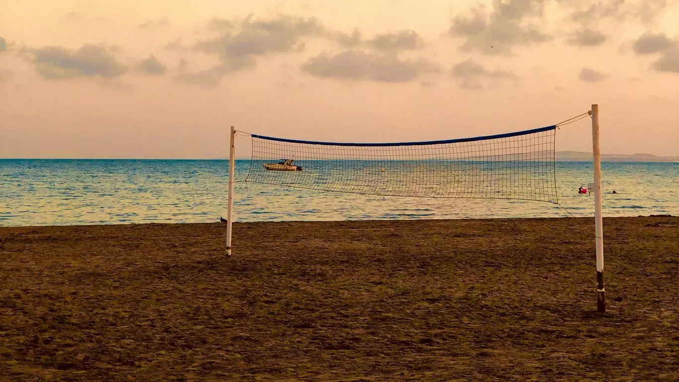Download wallpaper 1366x768 beach, volleyball, volleyball net, sea, horizon tablet, laptop HD background