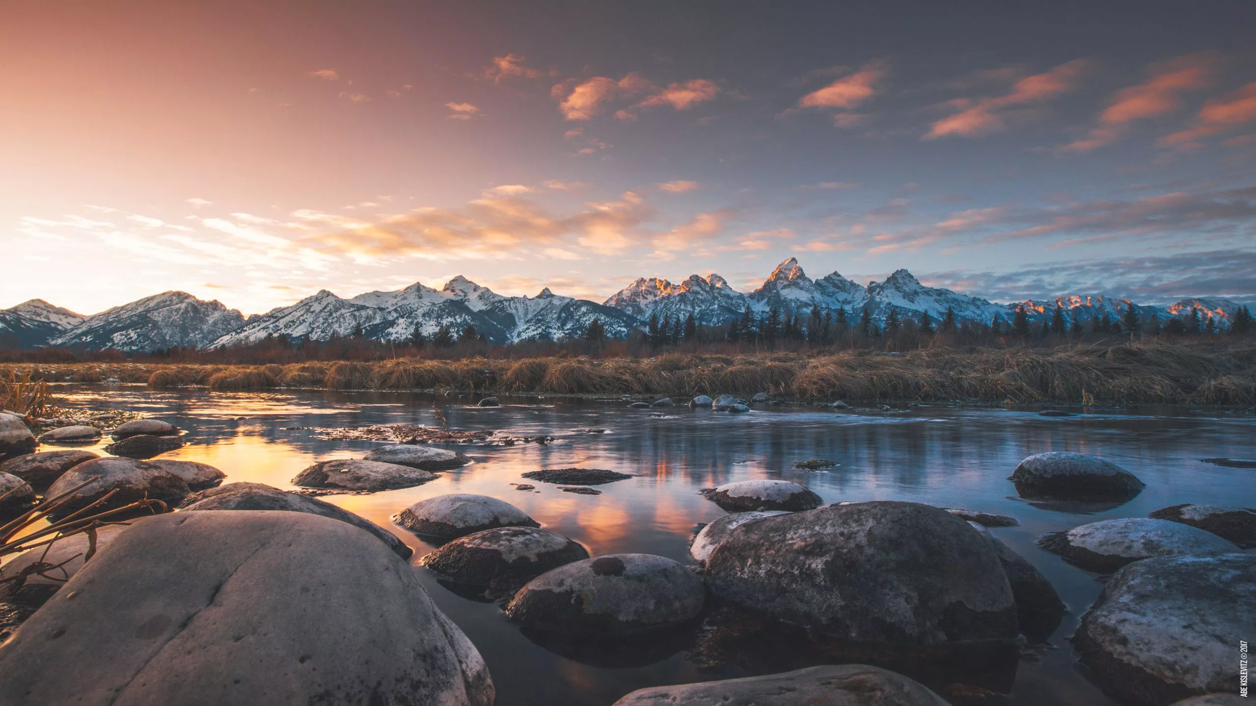 Snow Covered Mountains Stones On Water