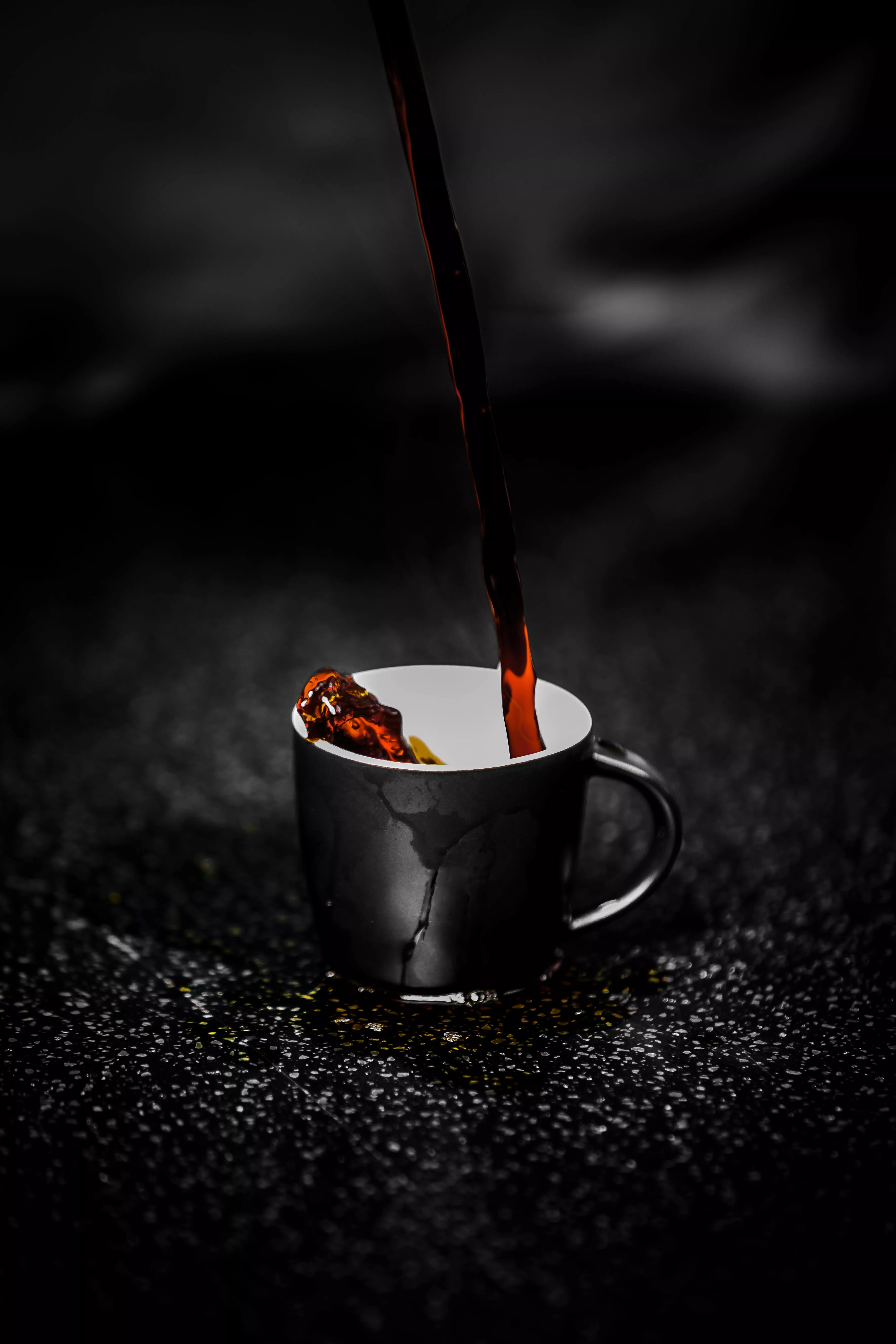 Brown Liquid Pouring on Black and White