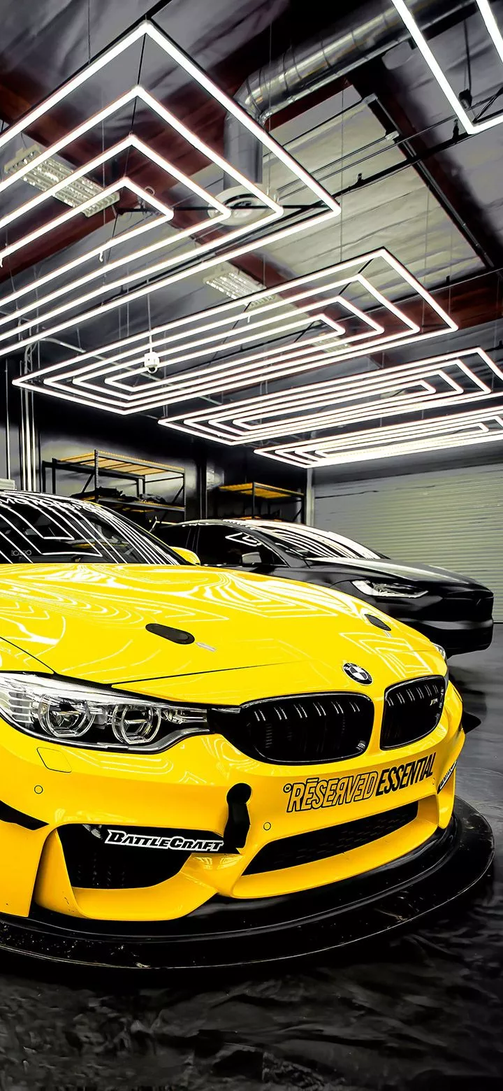Yellow BMW Inside Garage 4K Phone Wallpaper