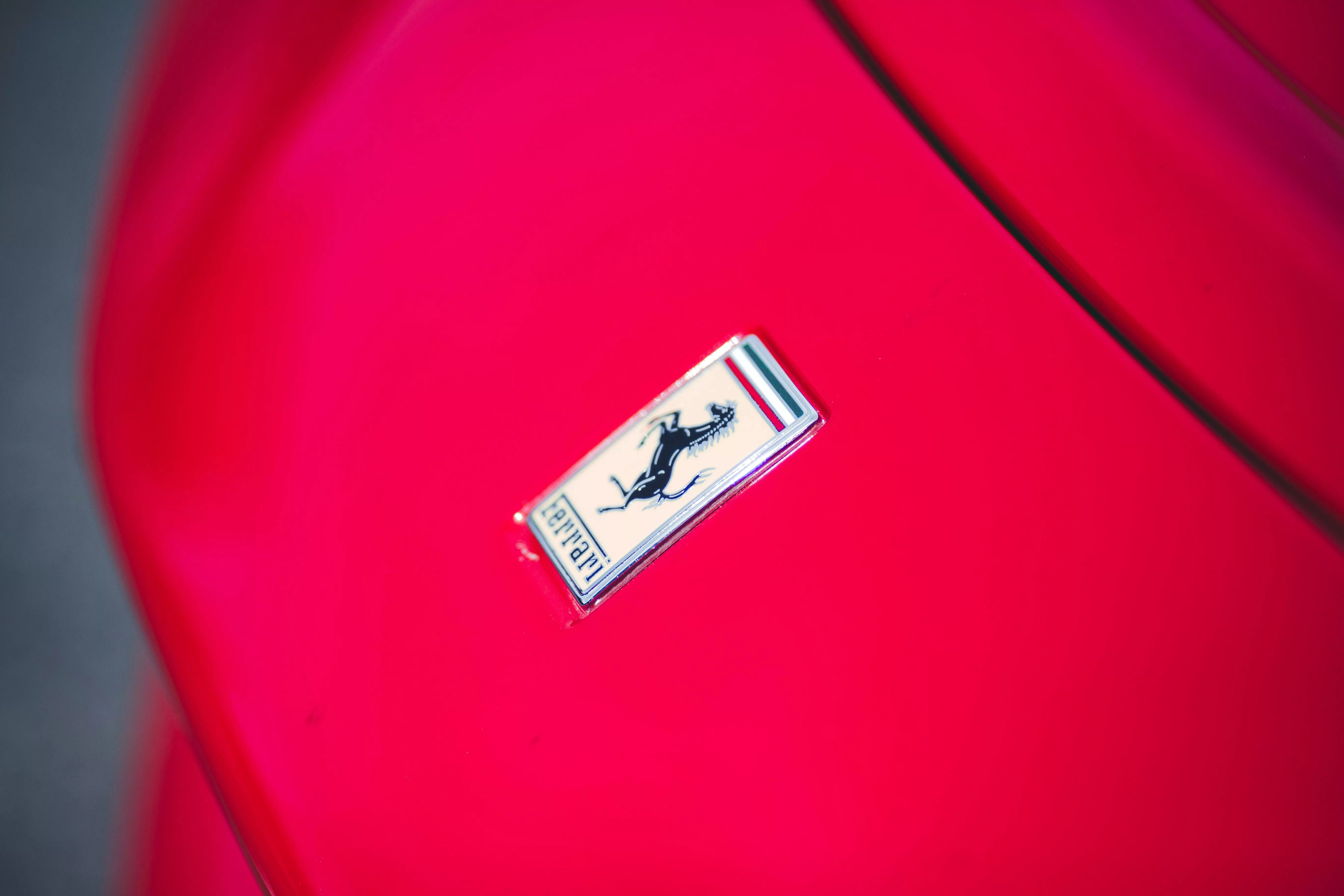 Ferrari Logo on a Red Car · Free Stock