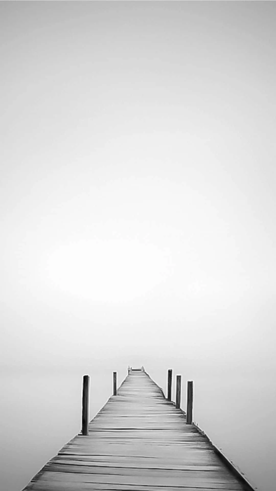 White Photo Of A Pier In The Fog