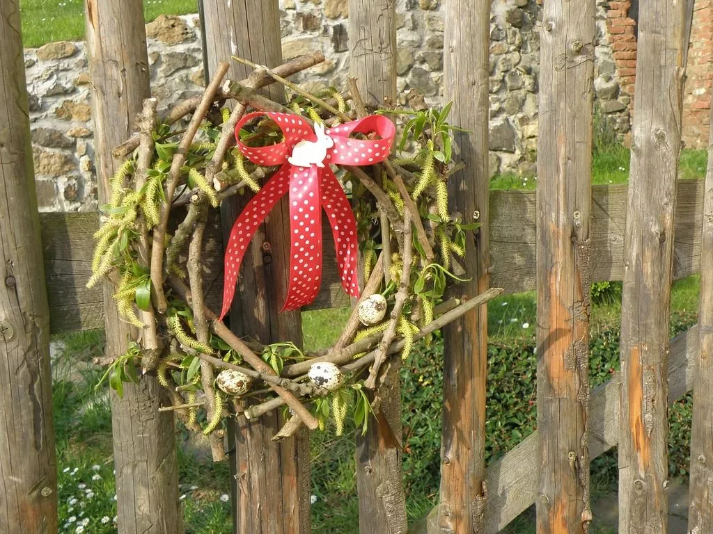 red bow. Gate wreath easter