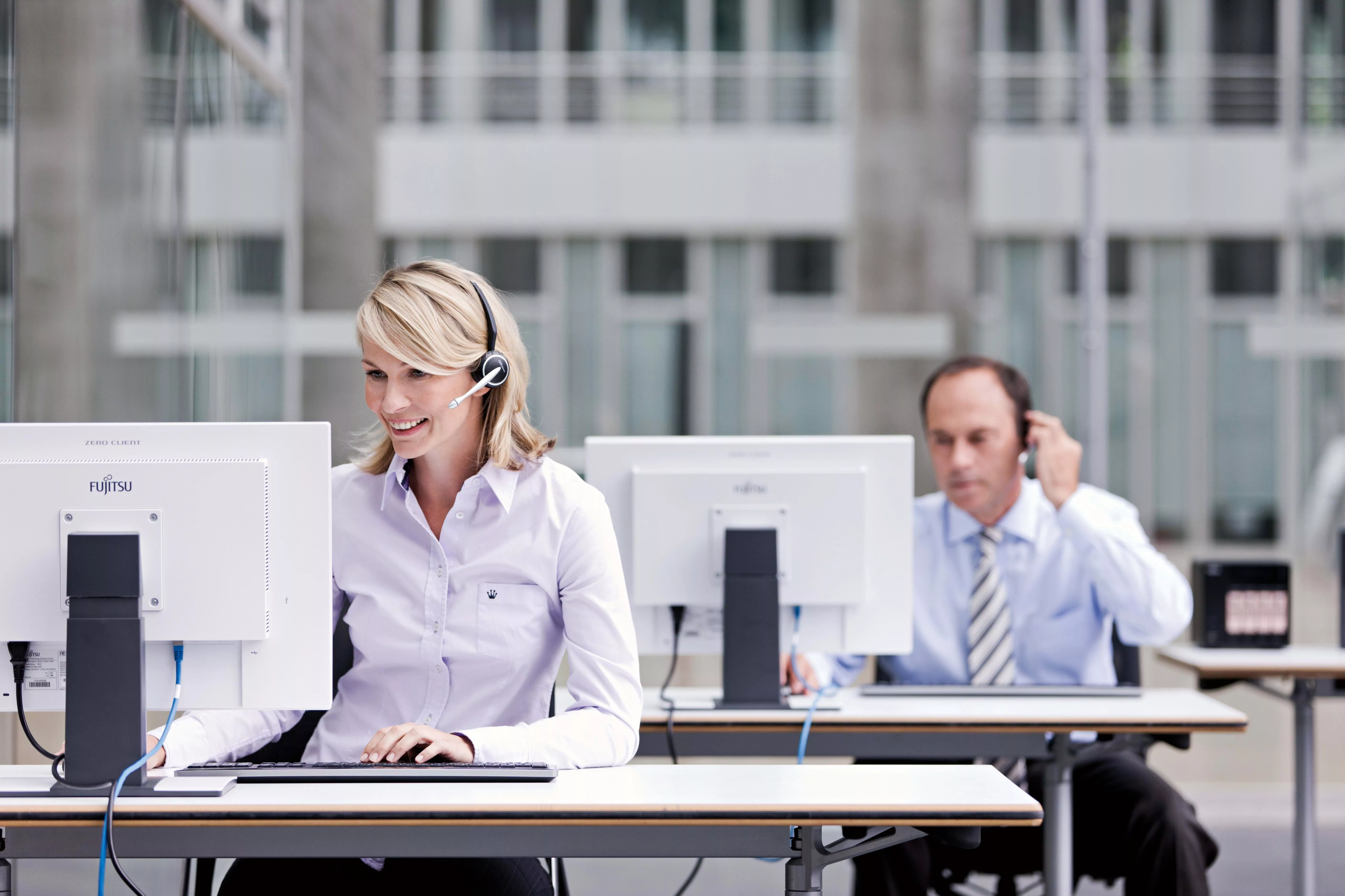 man sitting near computer desk