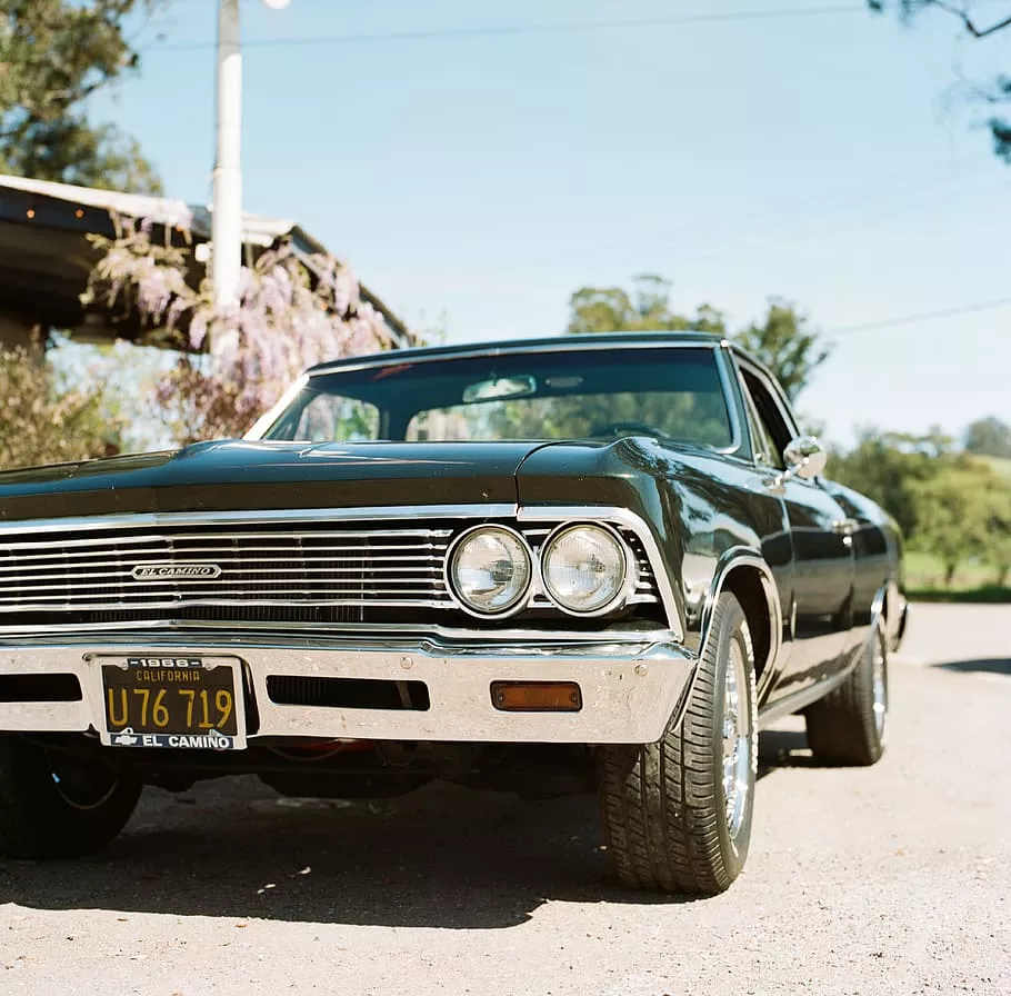 Beer, classic black coupe parked