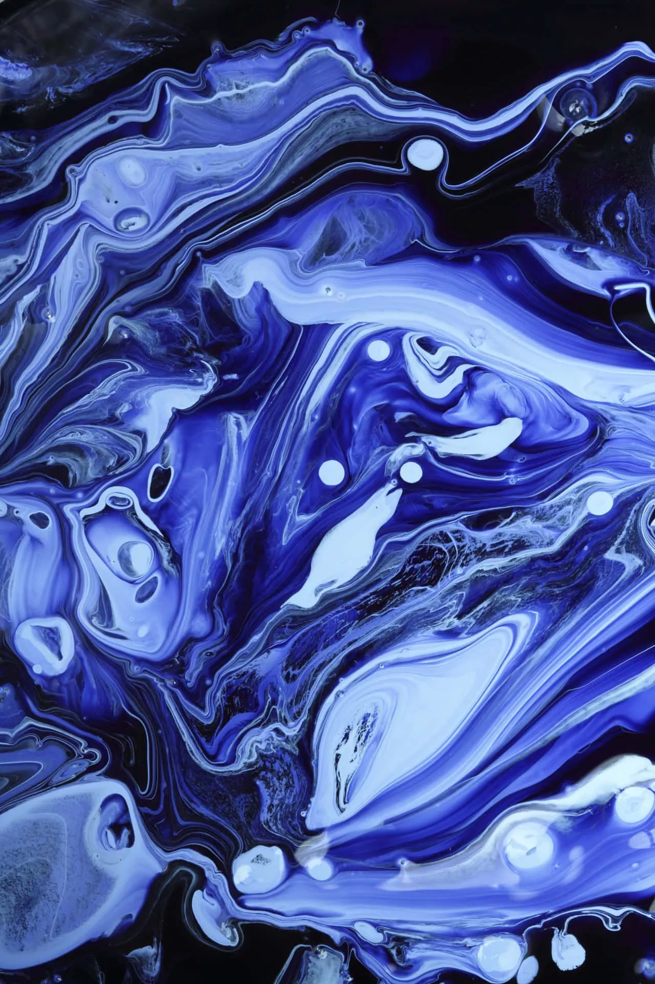Download A Blue Liquid With Swirls Of