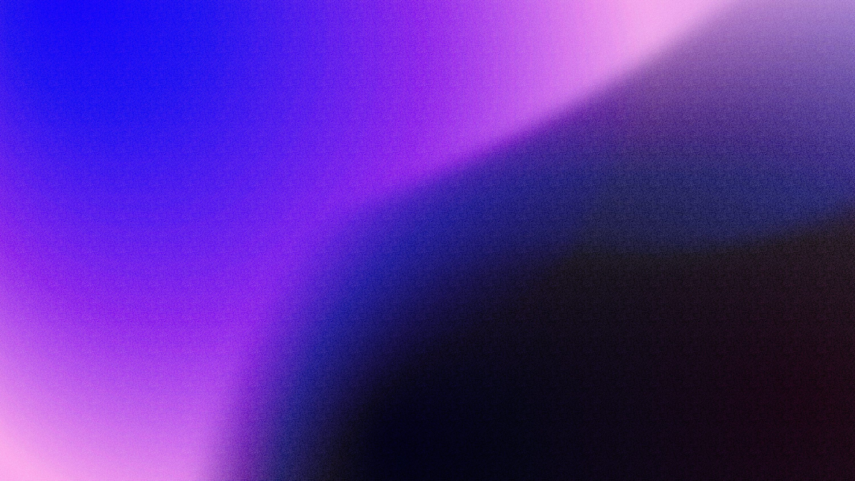 A blurry image of a purple and blue