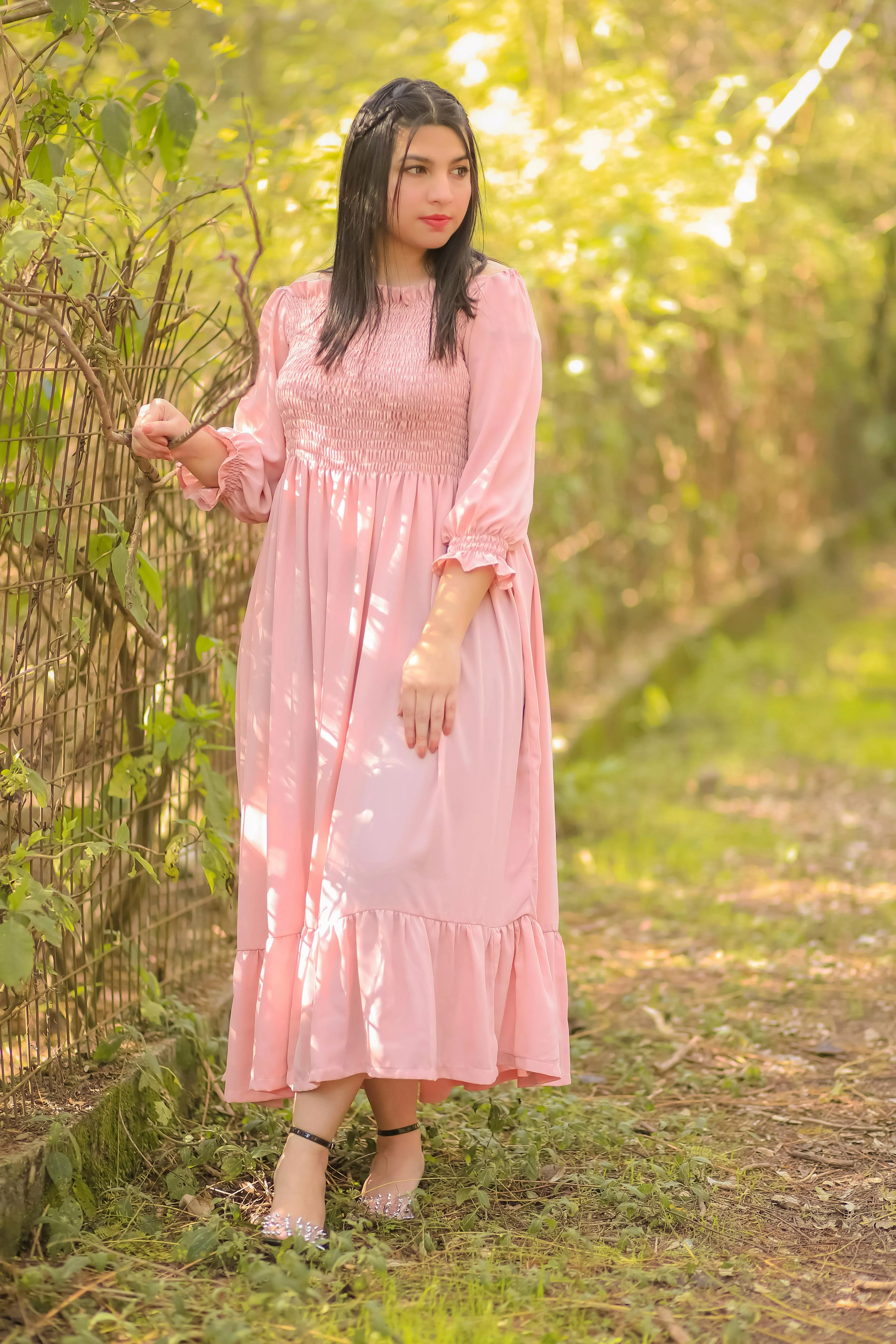 Girl in Dress Posing in Summer Garden