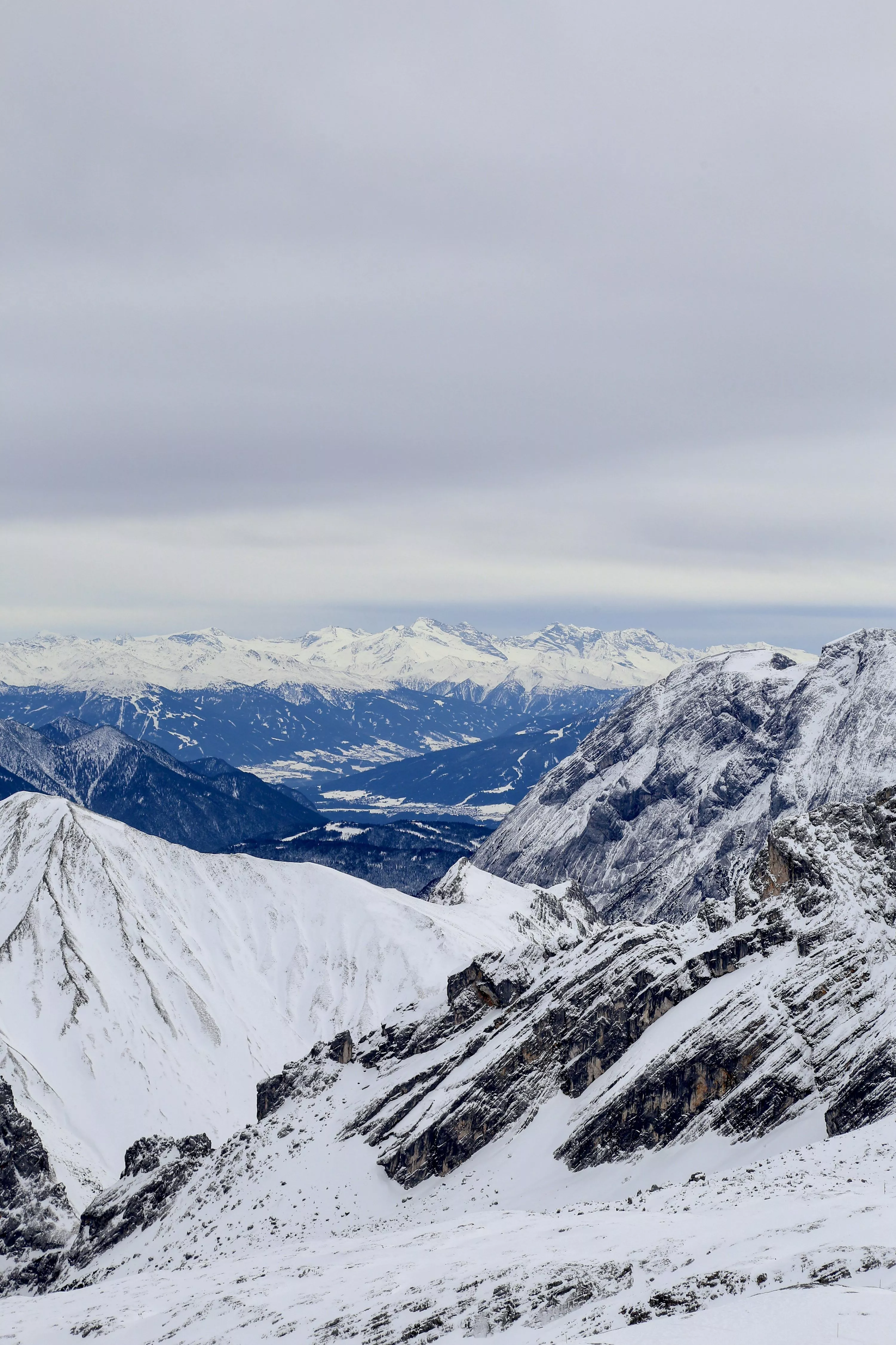 A snowy mountain range with mountains