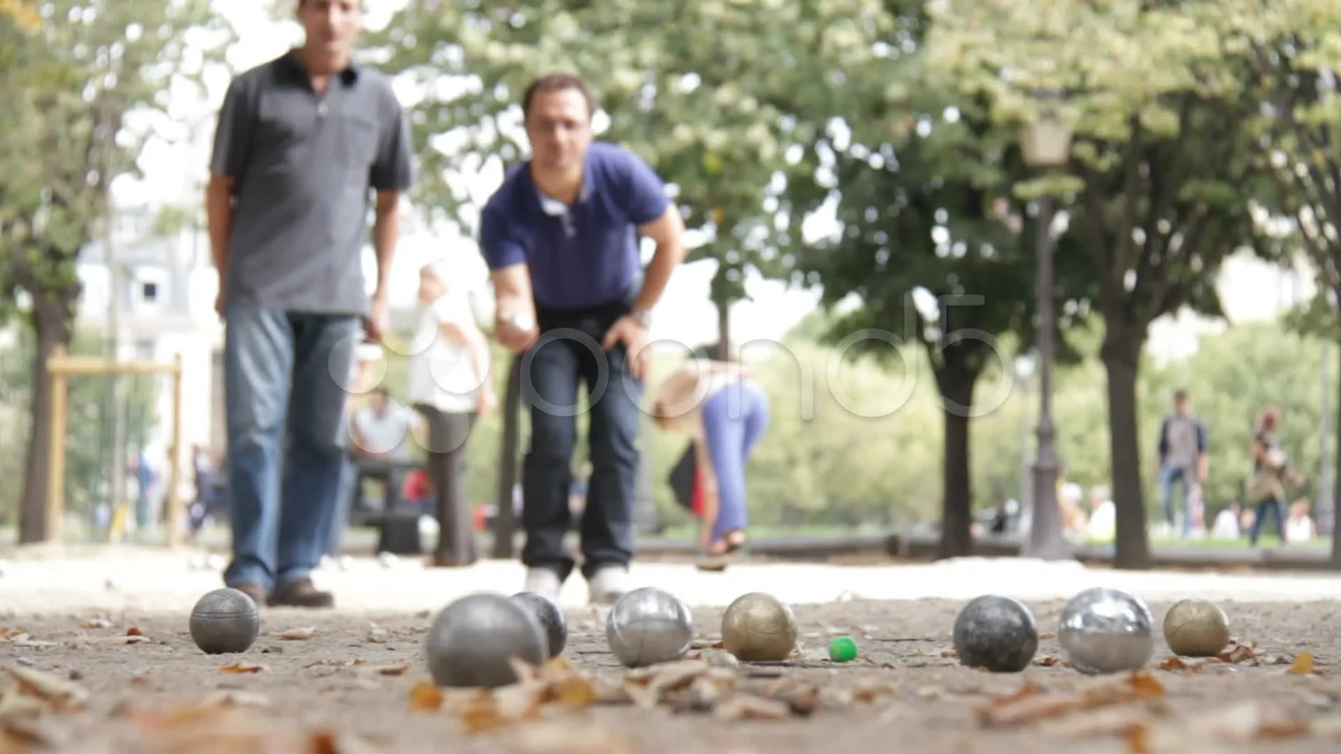 Man play petangue boules in Paris