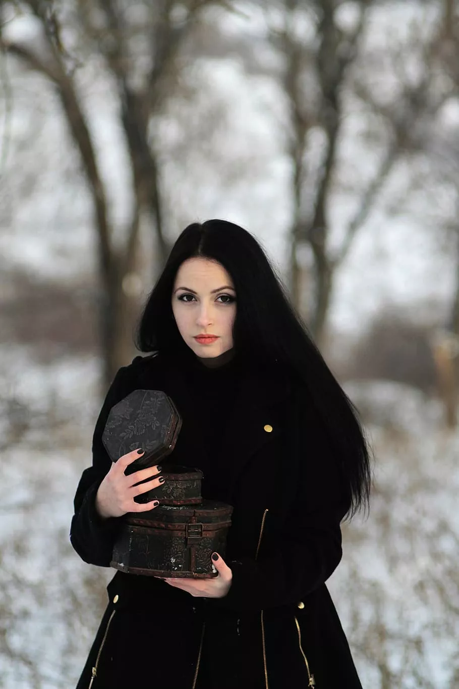 Pretty woman wearing black coat, cold