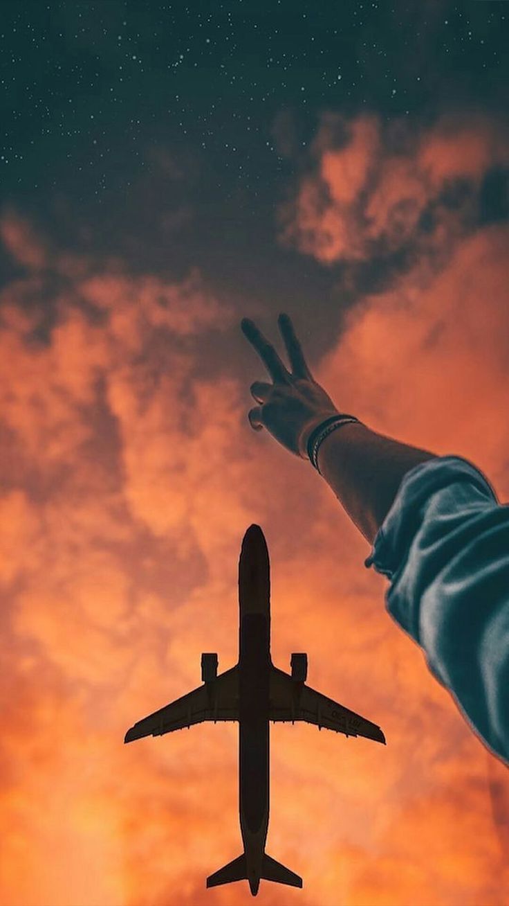 Plane in beautiful sunset sky. Travel