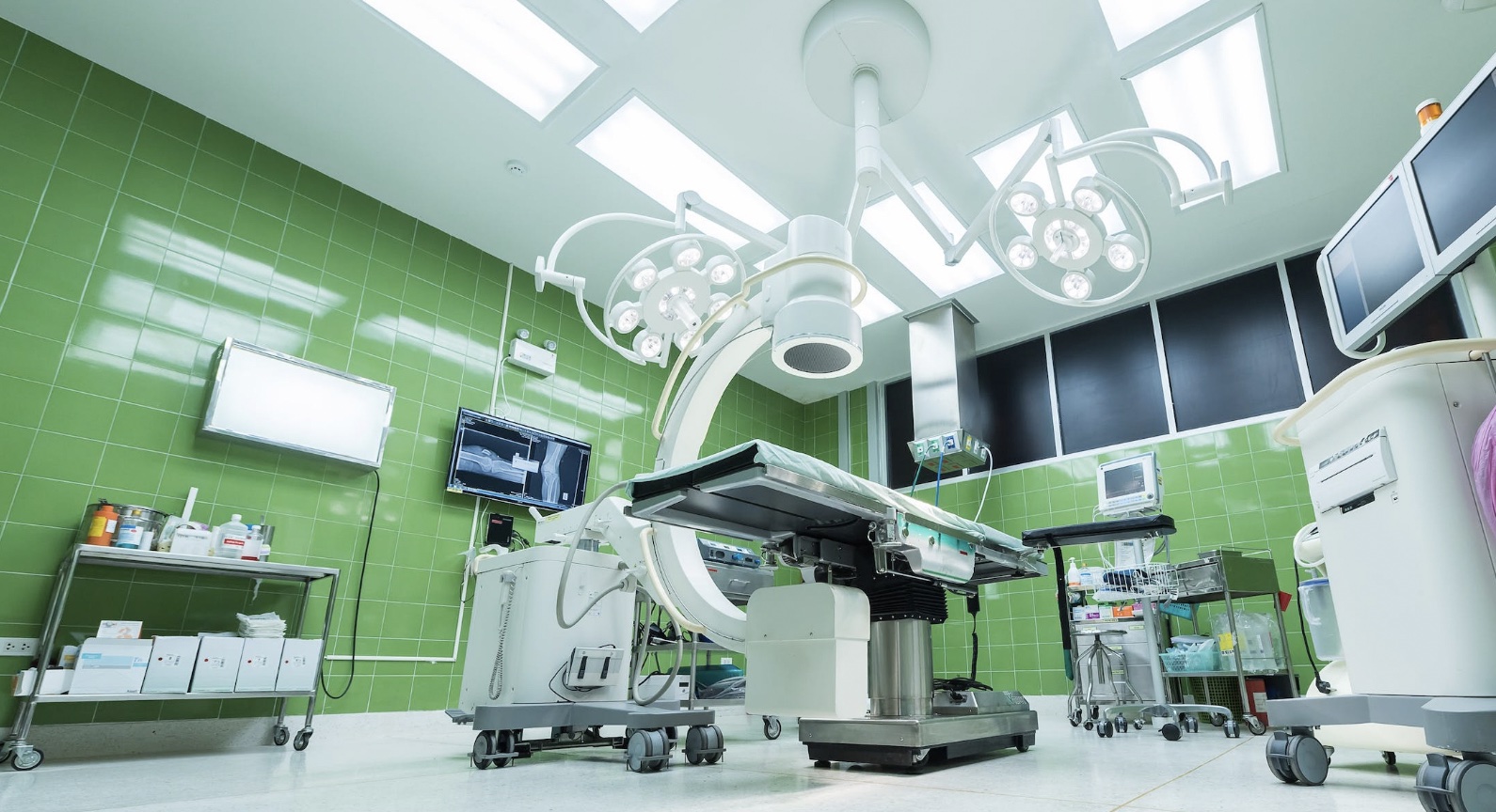 Empty operating room with green tile