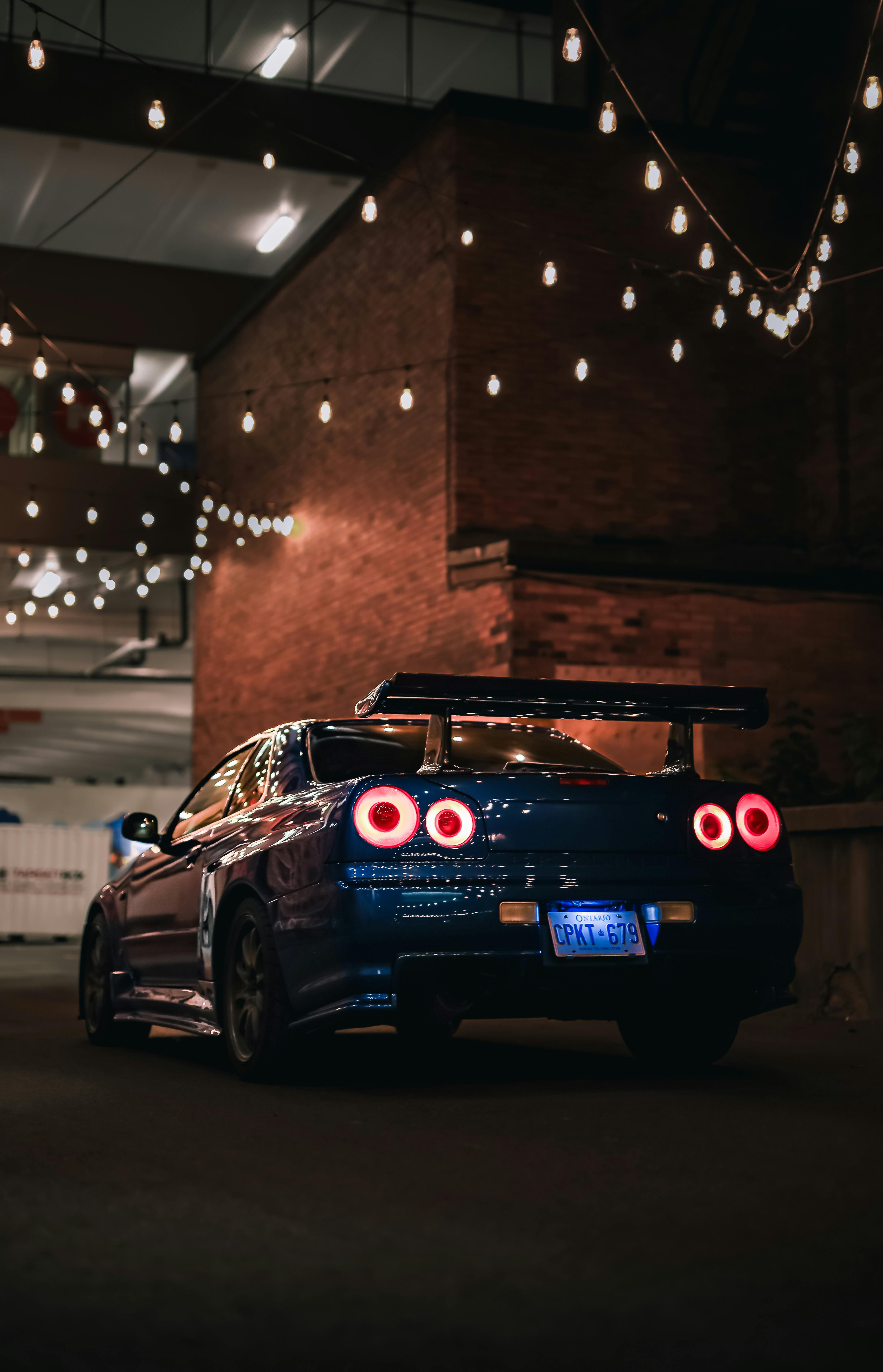 Nissan Skyline on Street at Night · Free