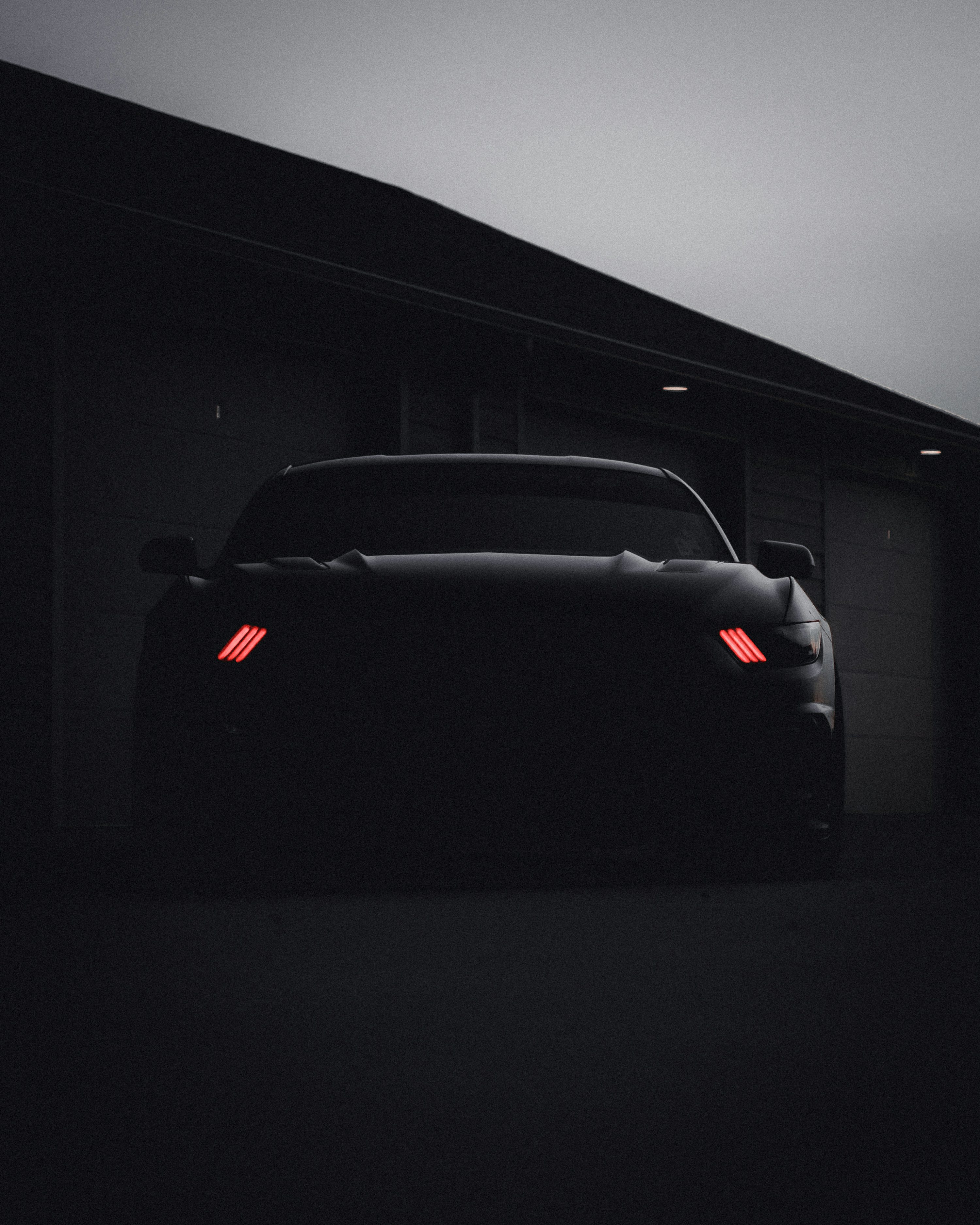 Black car in a dark room photo