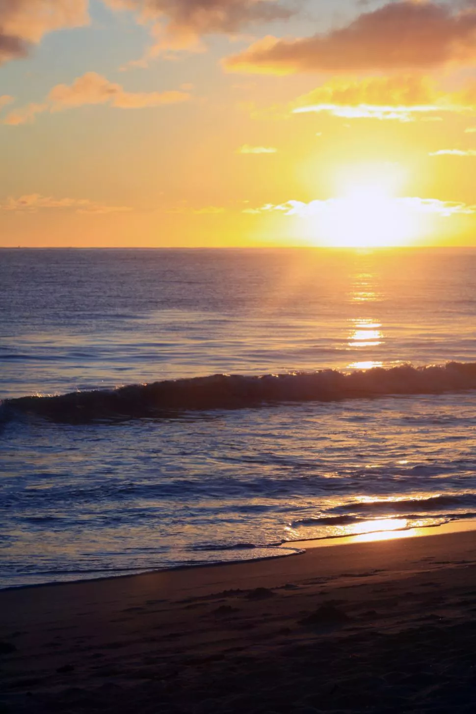 Photo of A sunset over a Hawaiian beach