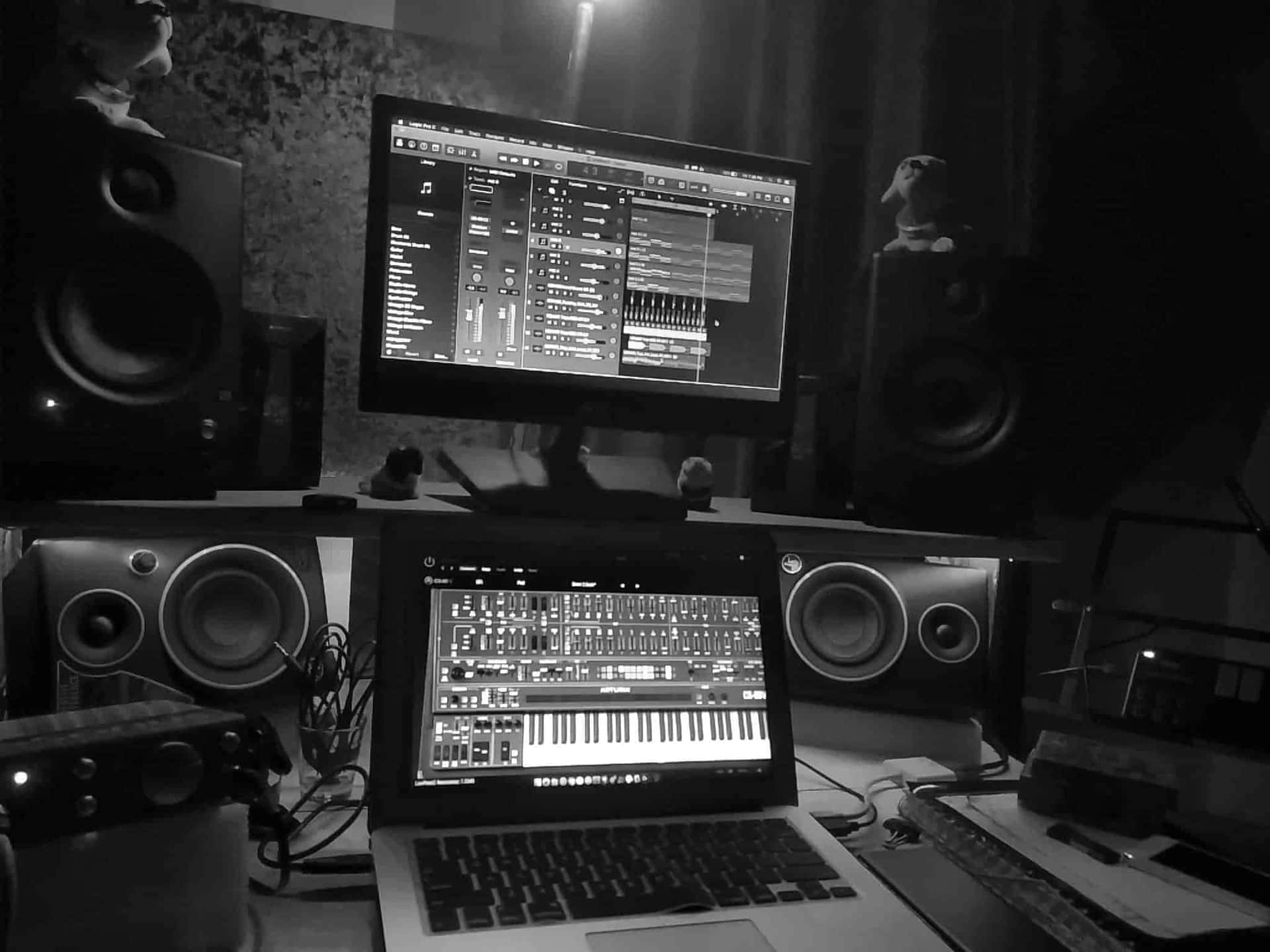 Photo Of A Laptop And Speakers