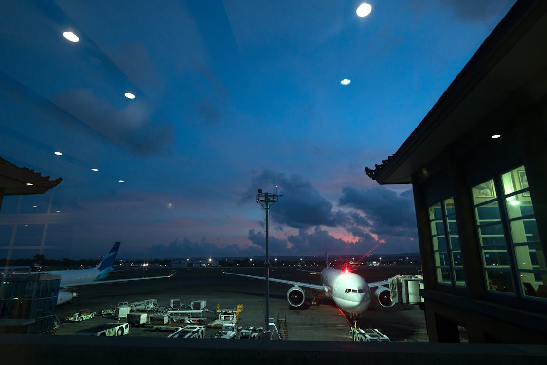 Night airport with planes on airfield