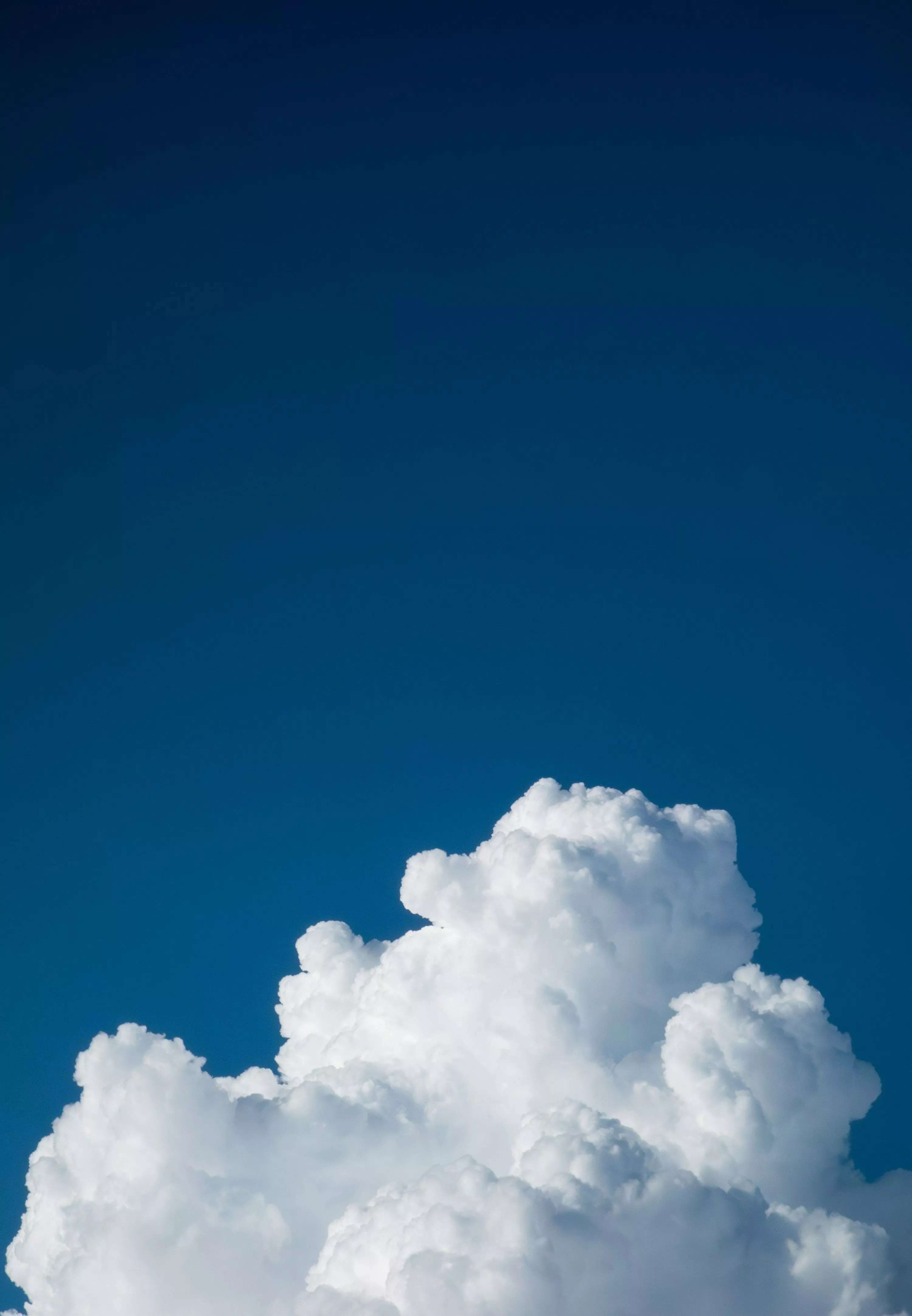 plane flying through a cloud filled sky