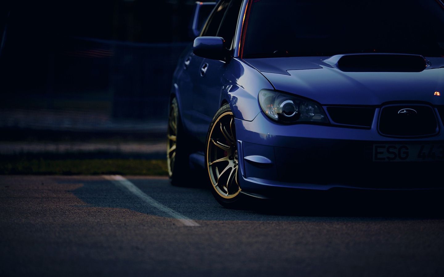 The dark blue car Subaru Impreza WRX