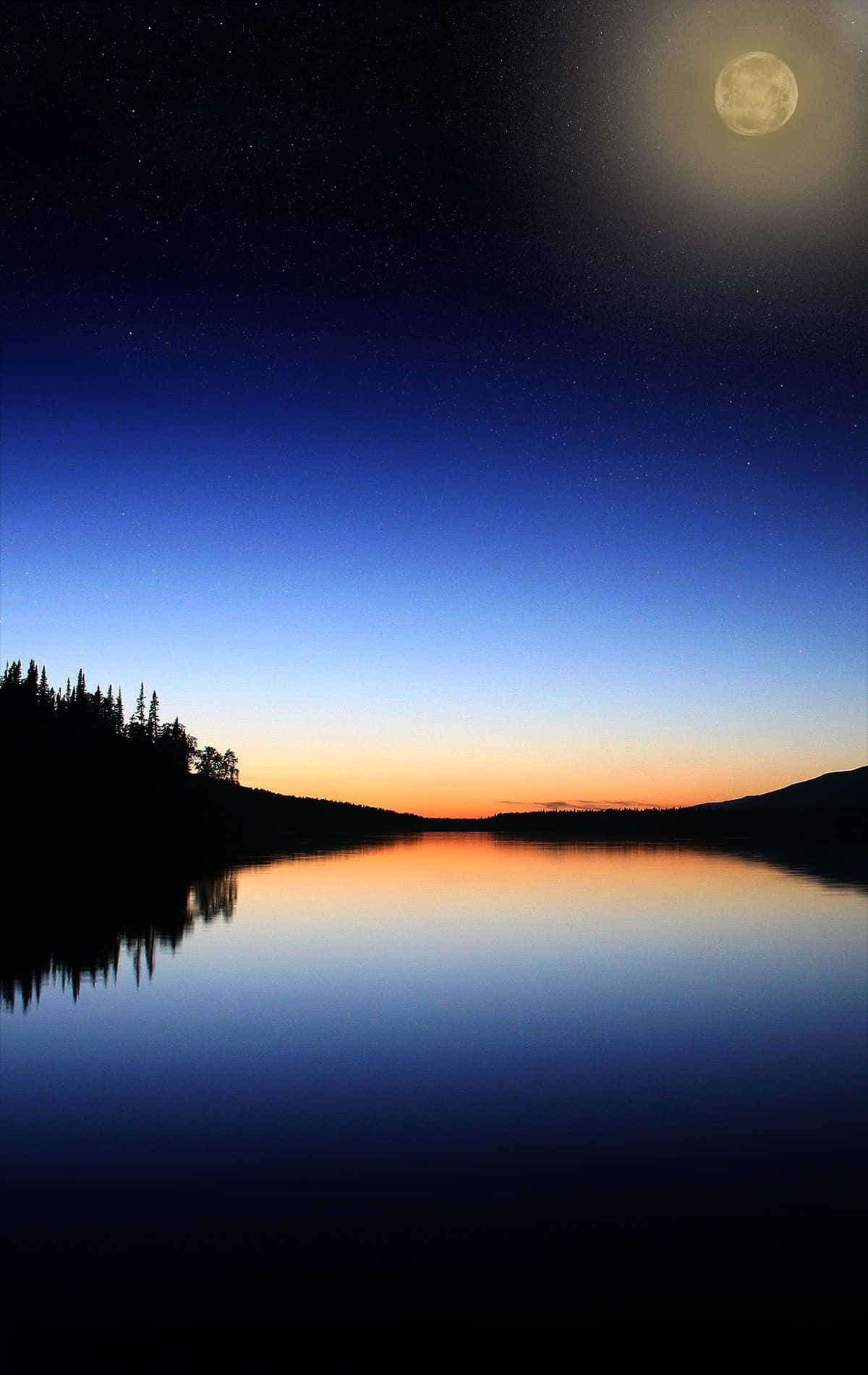 Reflected In A Lake At Night Wallpaper