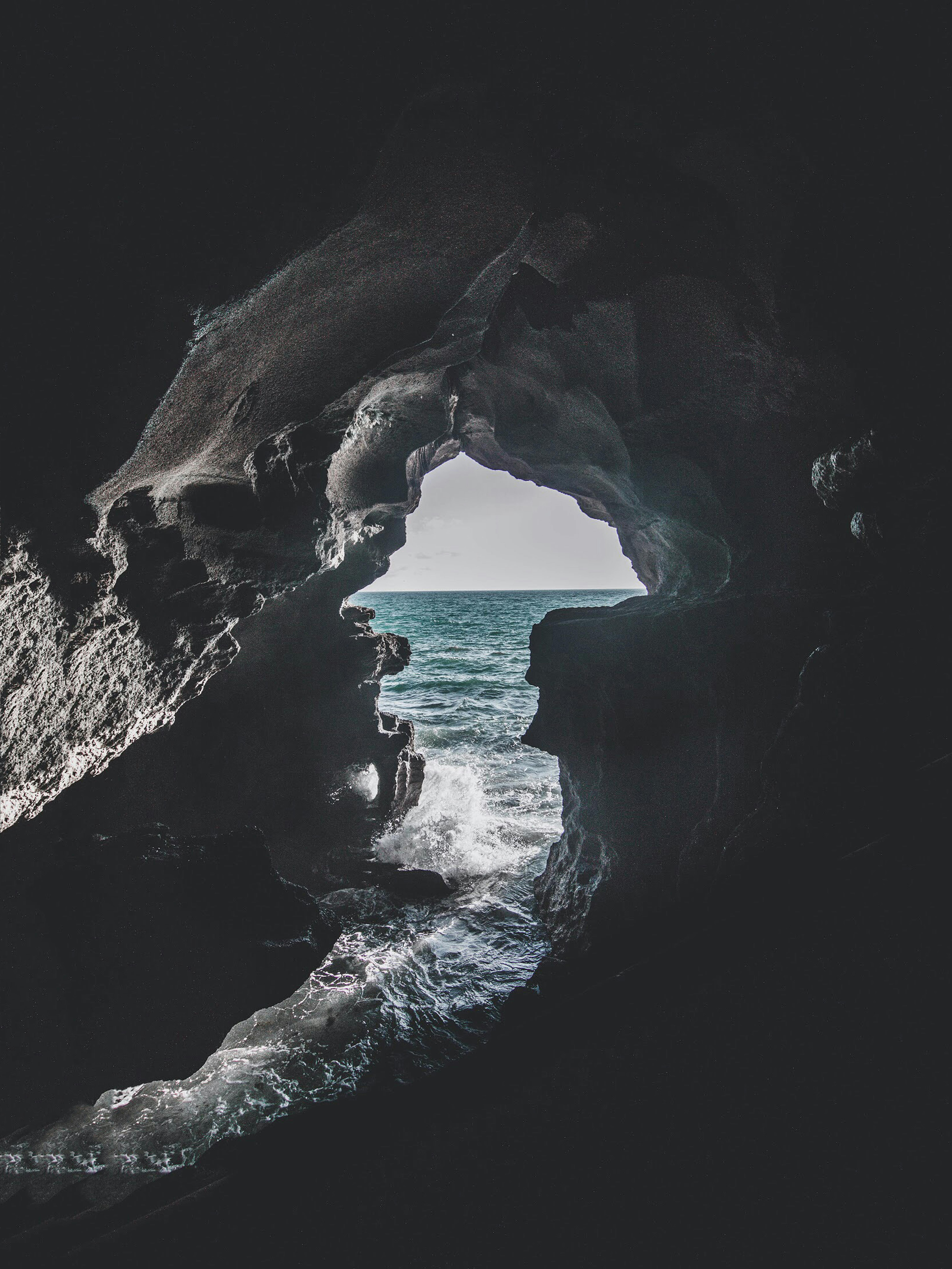 Gray Cave Near Body of Water · Free