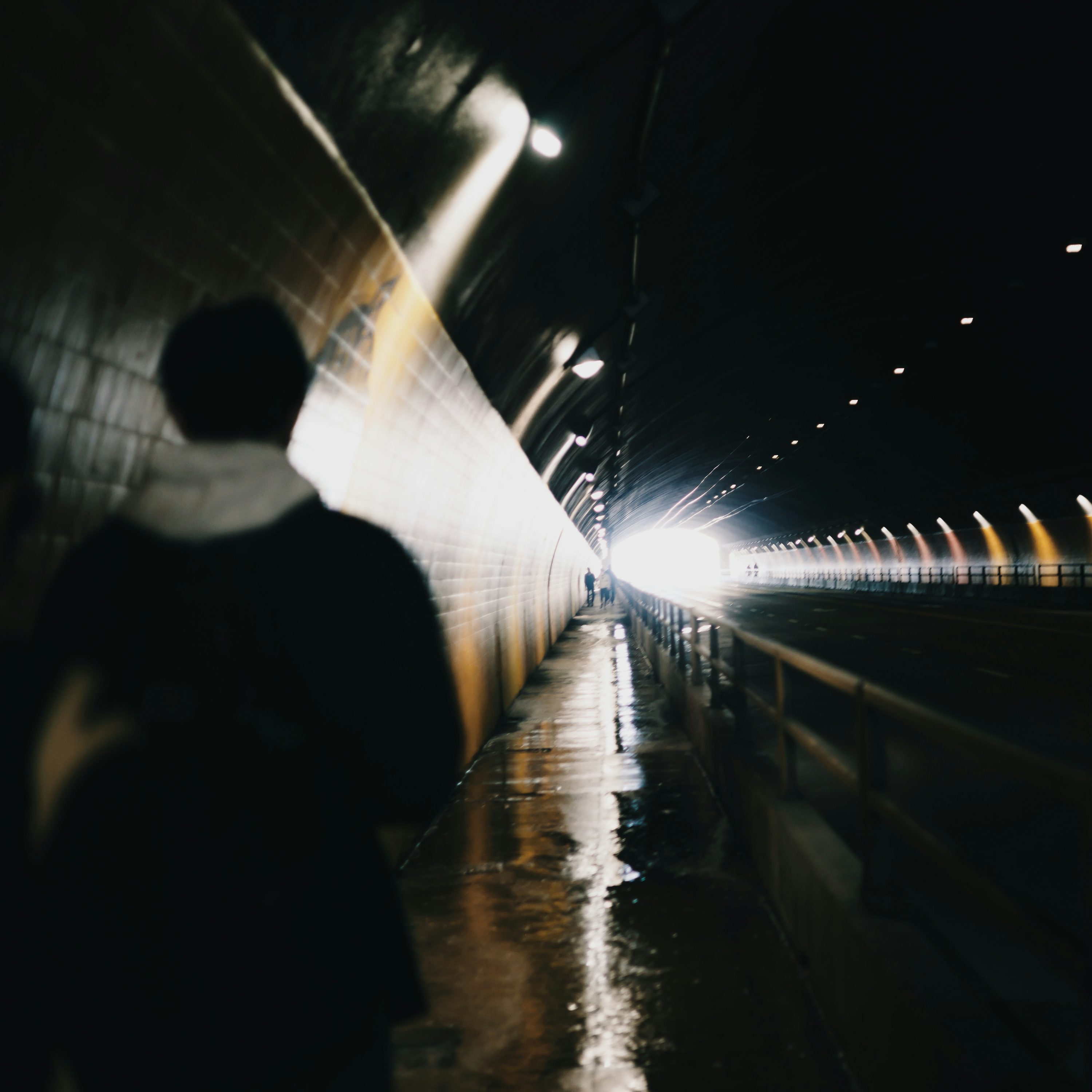 A blurry photo of a person walking in a