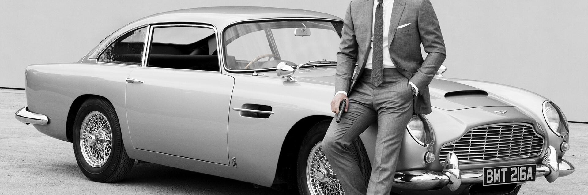 james bond with vintage ast martin