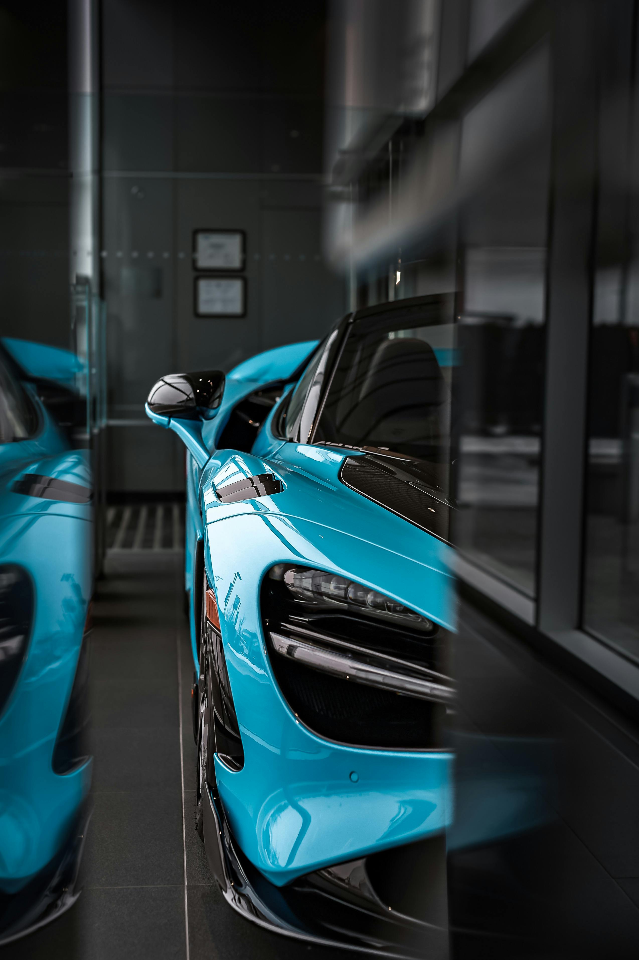 Blue McLaren 765LT behind Wall · Free