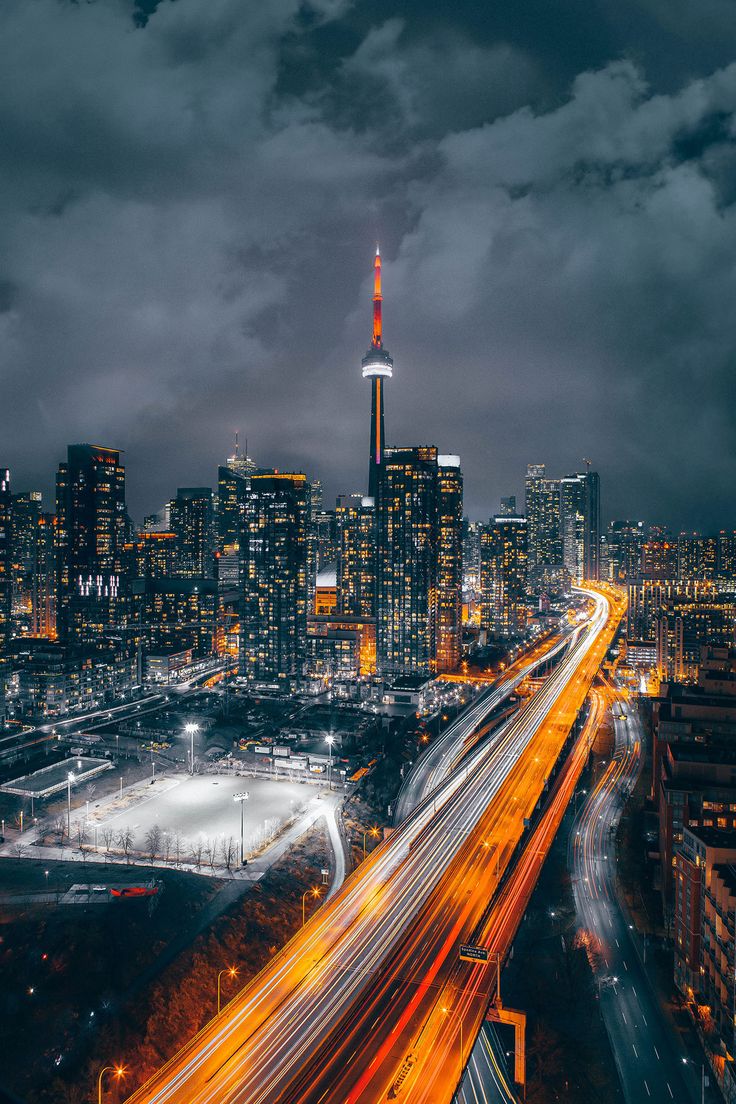 Rooftop View in Downtown, Toronto, Canada Photo by Idil Mohamed Insta #city #cityscape #travel #travelgram #travelphotography #nightshot #cloudynight #Canada #Toronto #citylights