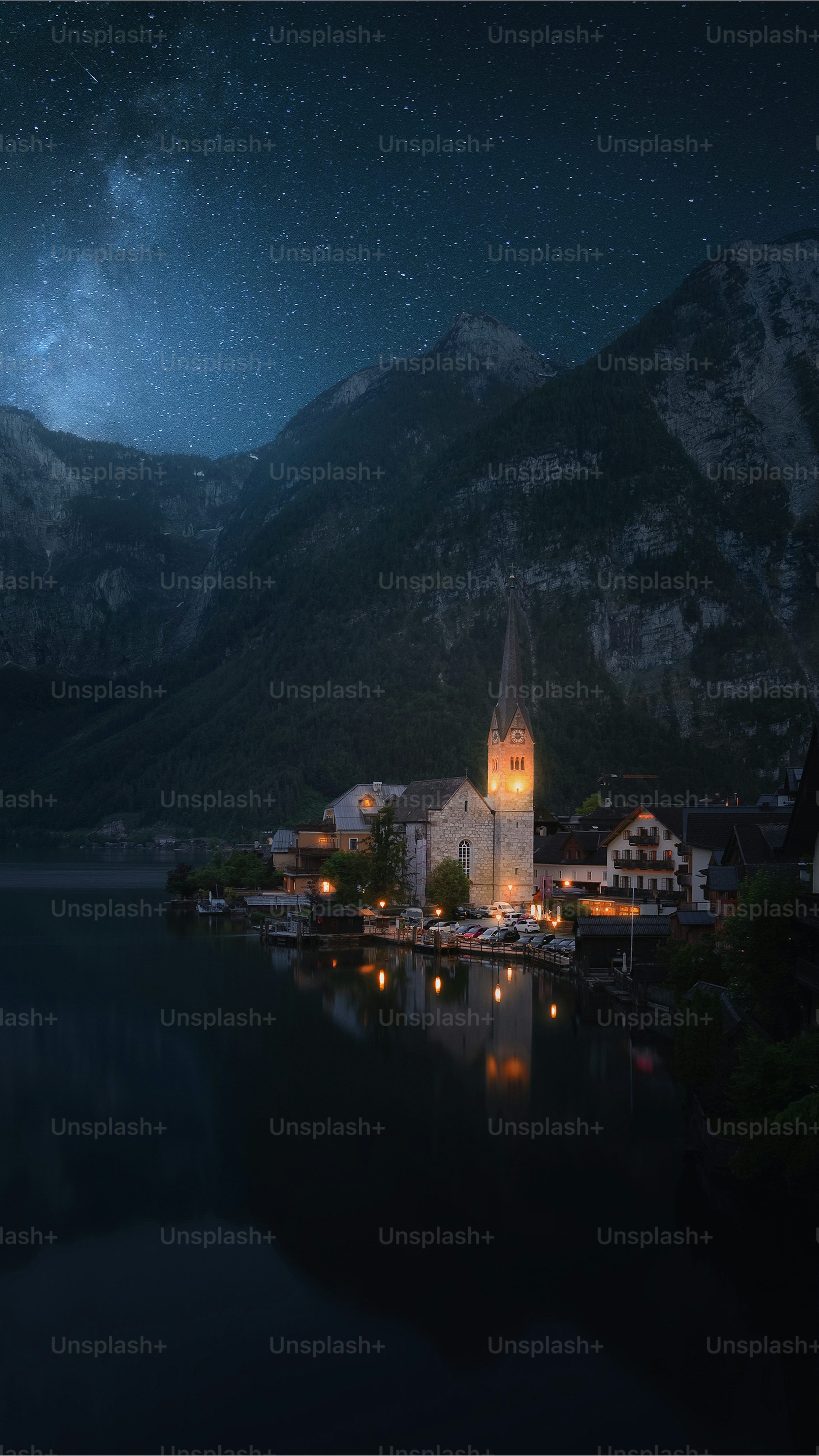 A night scene of a small town on a lake