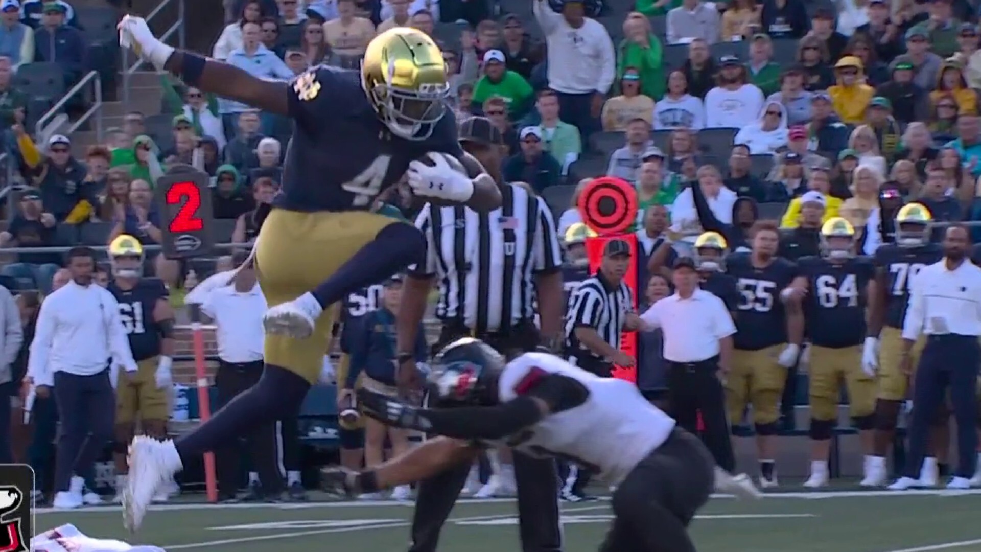 Love hurdles Northern Illinois defender