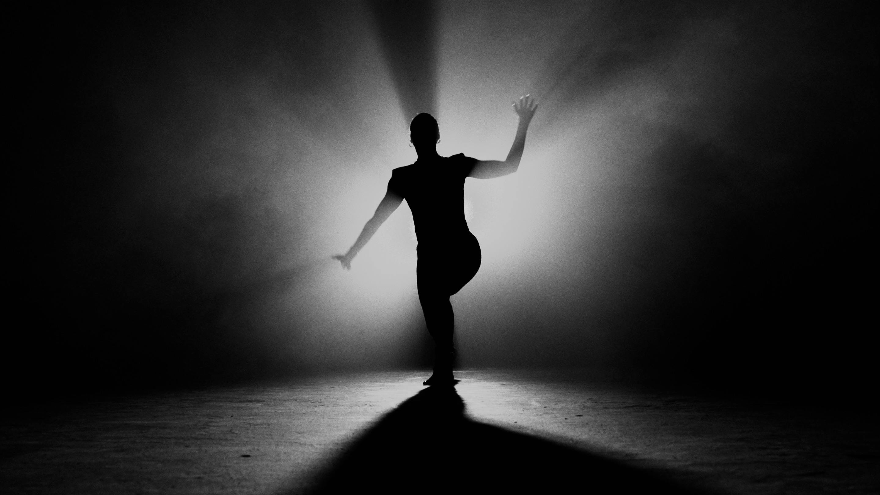 Silhouette of Person Dancing