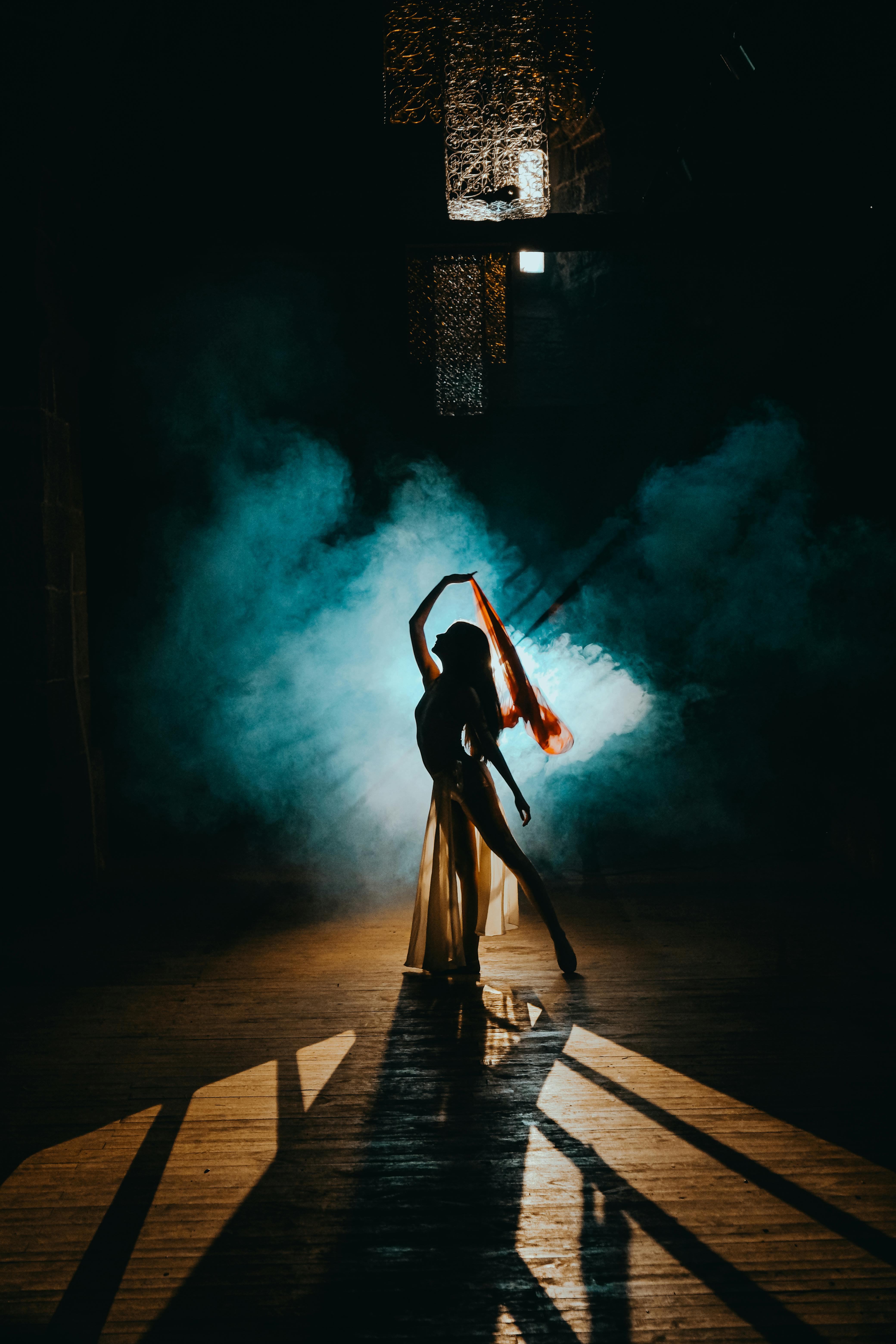 Silhouette of a Dancer Amid Smoke