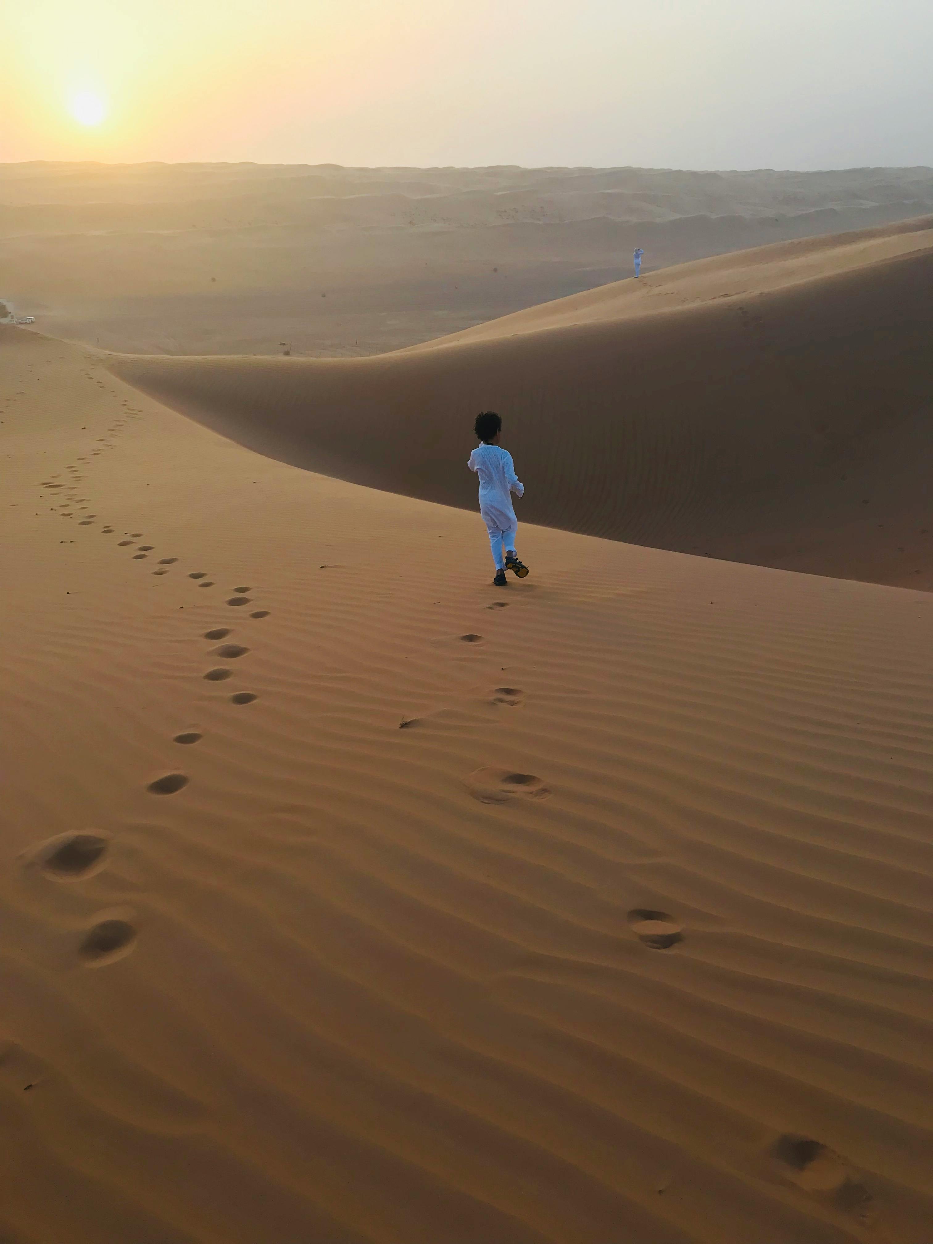 Muslim Boy in White Thobe Walking Alone