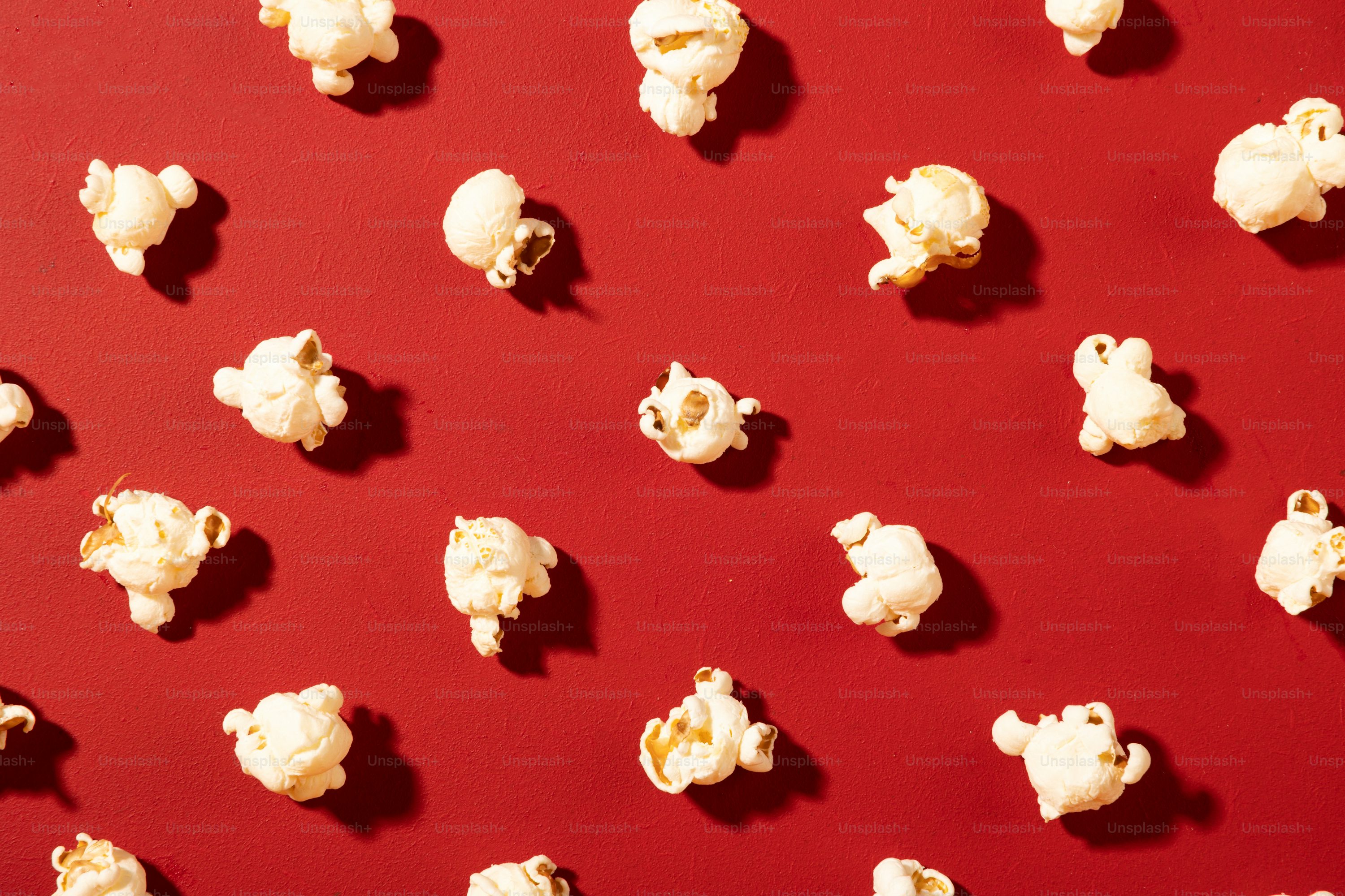 popcorn sitting on top of a red table