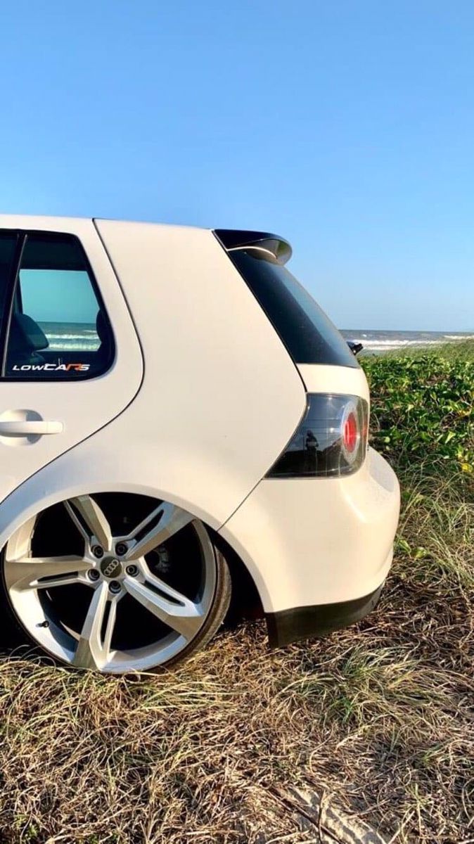 VW Golf Car on Grass Field