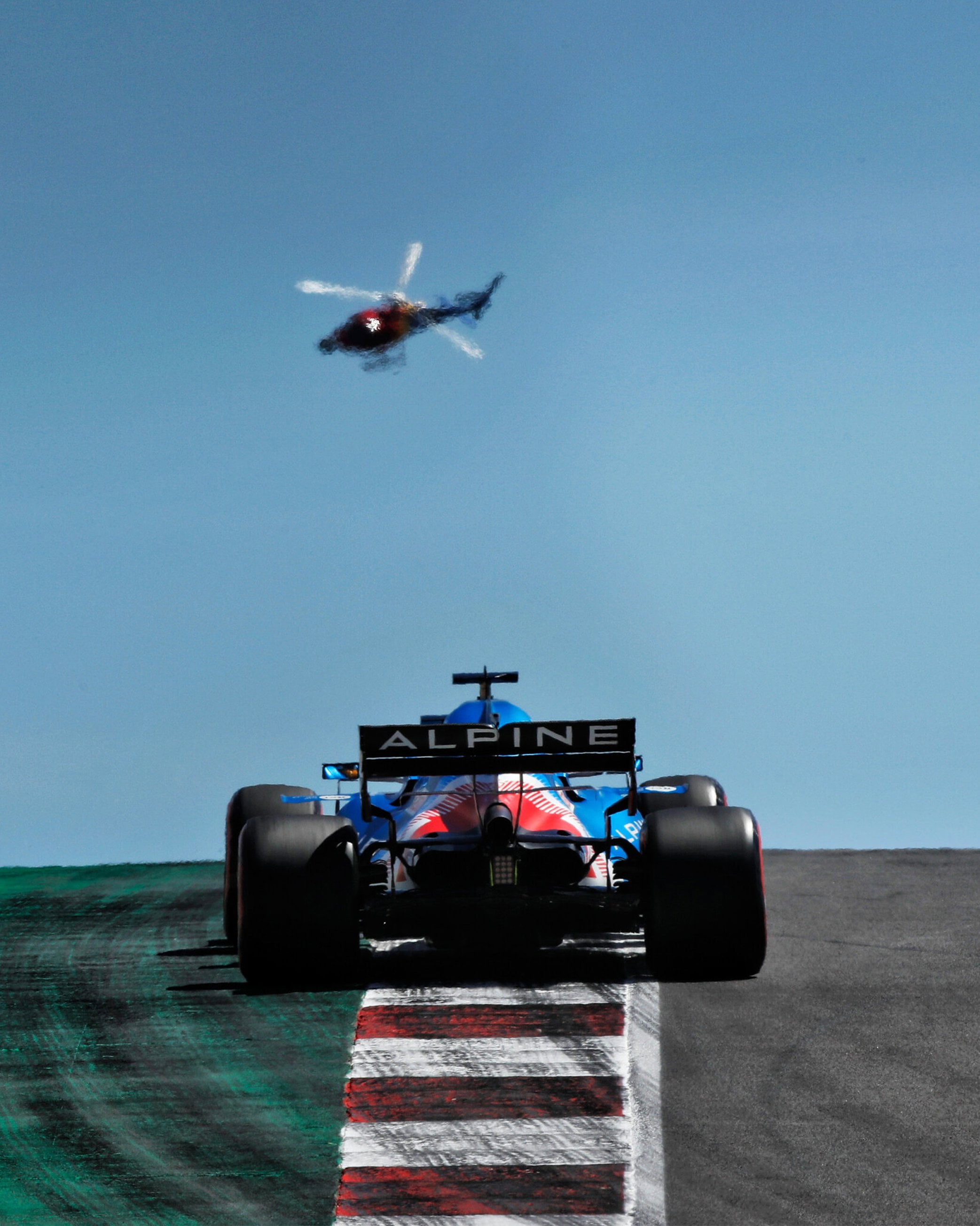 A quick edit I made for a mobile phone wallpaper. Fernando Alonso heading over the crest at Portimao (1440x3200)