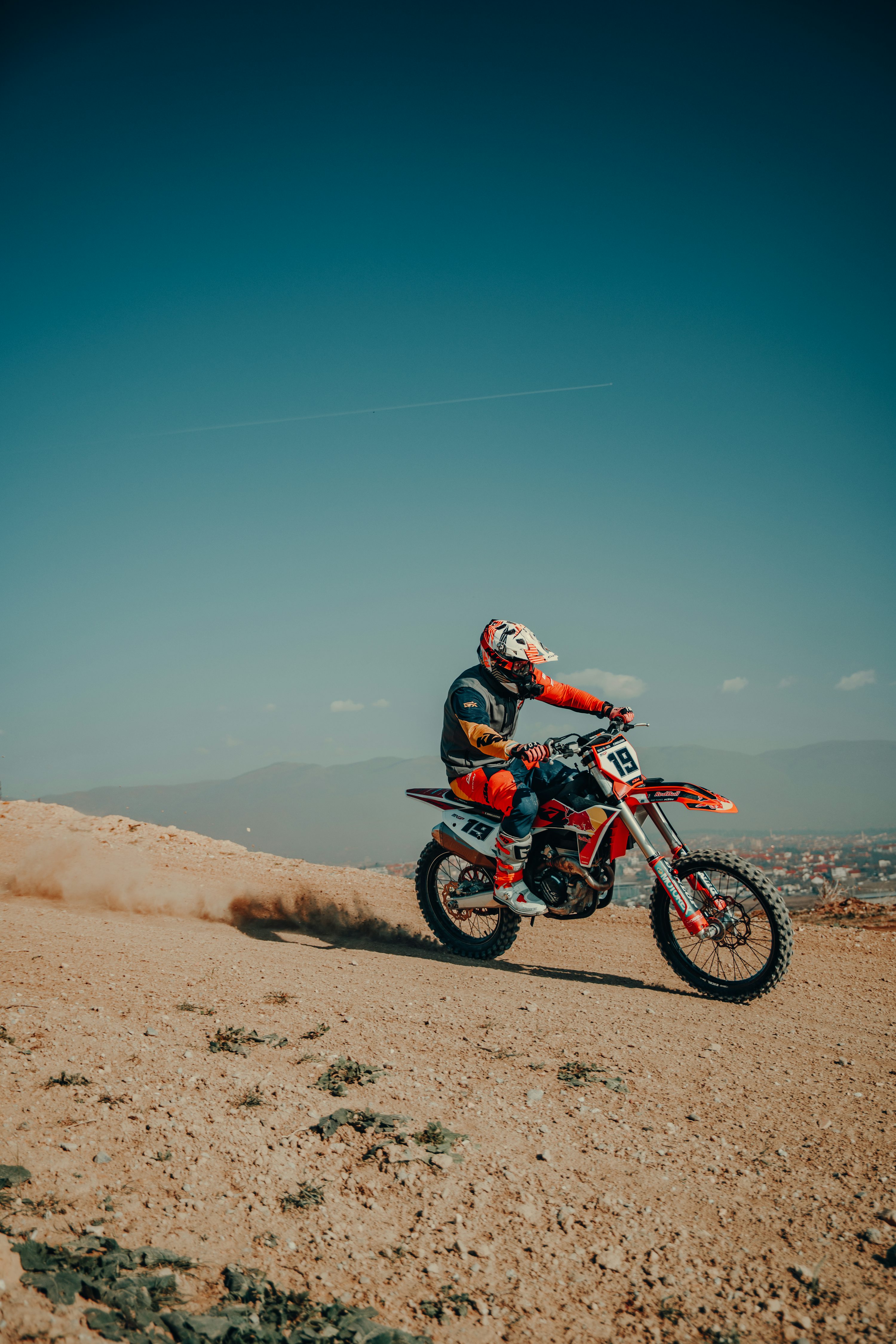 A man riding a dirt bike on top of a